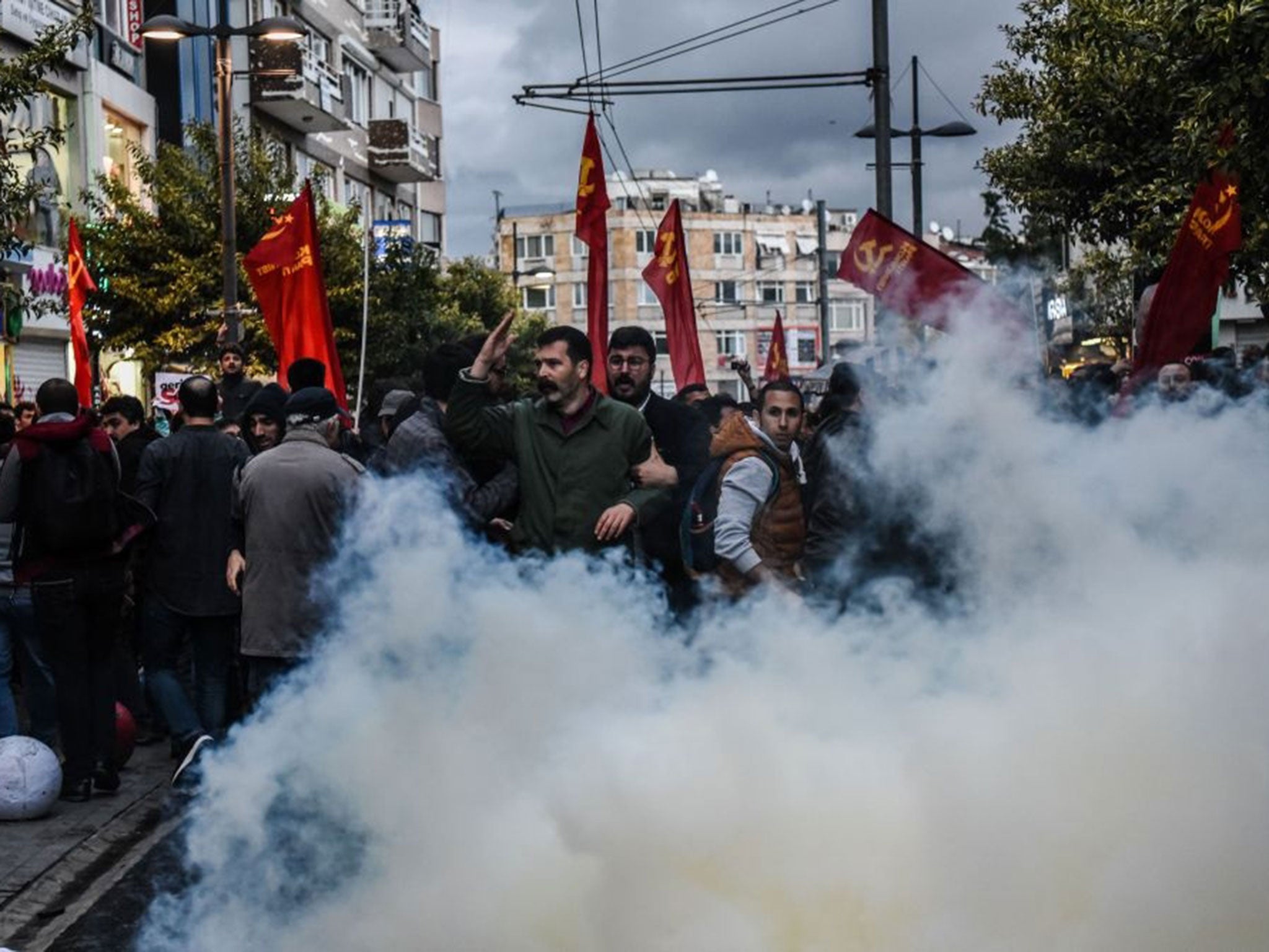 Turkish anti riot police use tear gas to disperse demonstrators during a protest against a call for the country to adopt a religious constitution on 26 April, 2016, at Kadikoy district in Istanbul