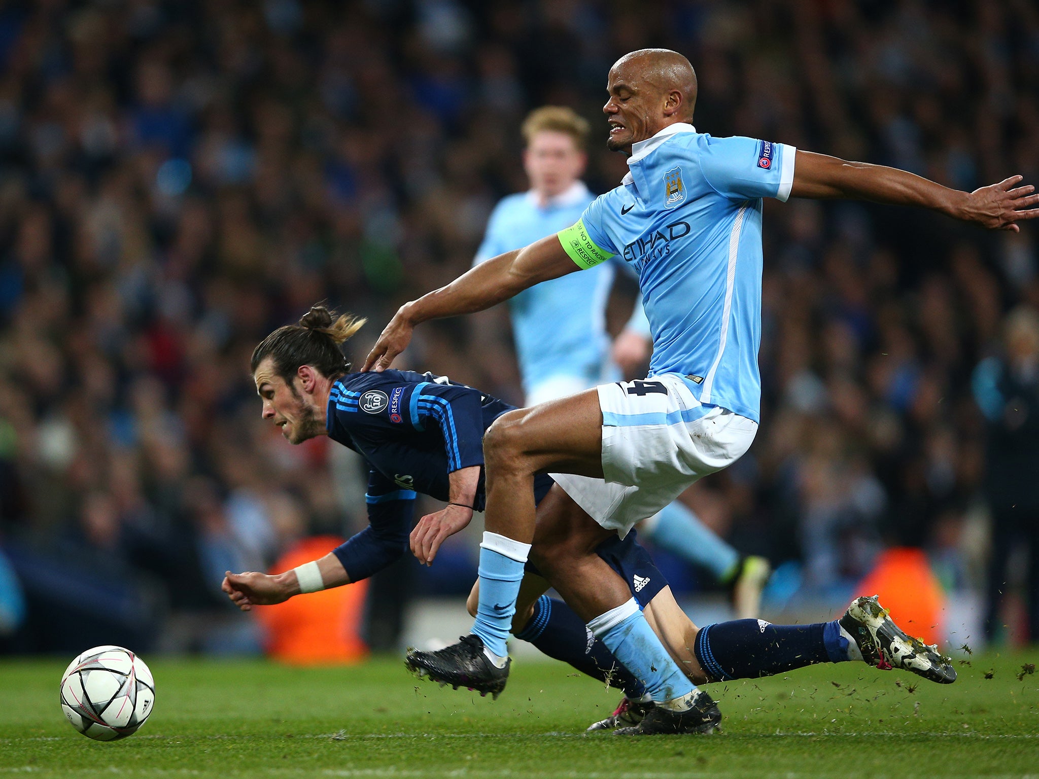 Vincent Kompany tackles Gareth Bale