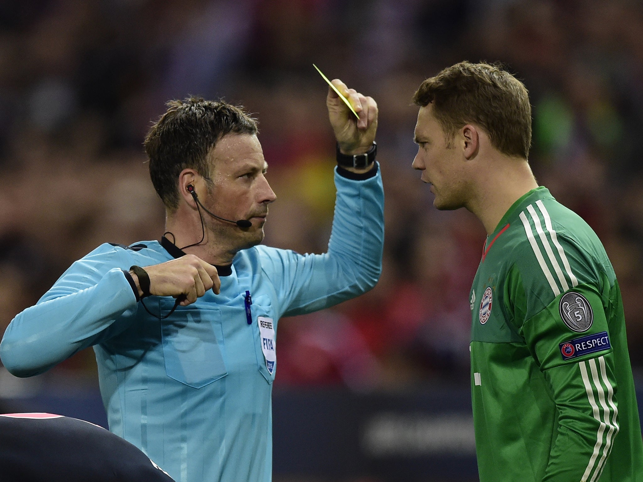 &#13;
Mark Clattenburg books Manuel Neuer (Getty )&#13;