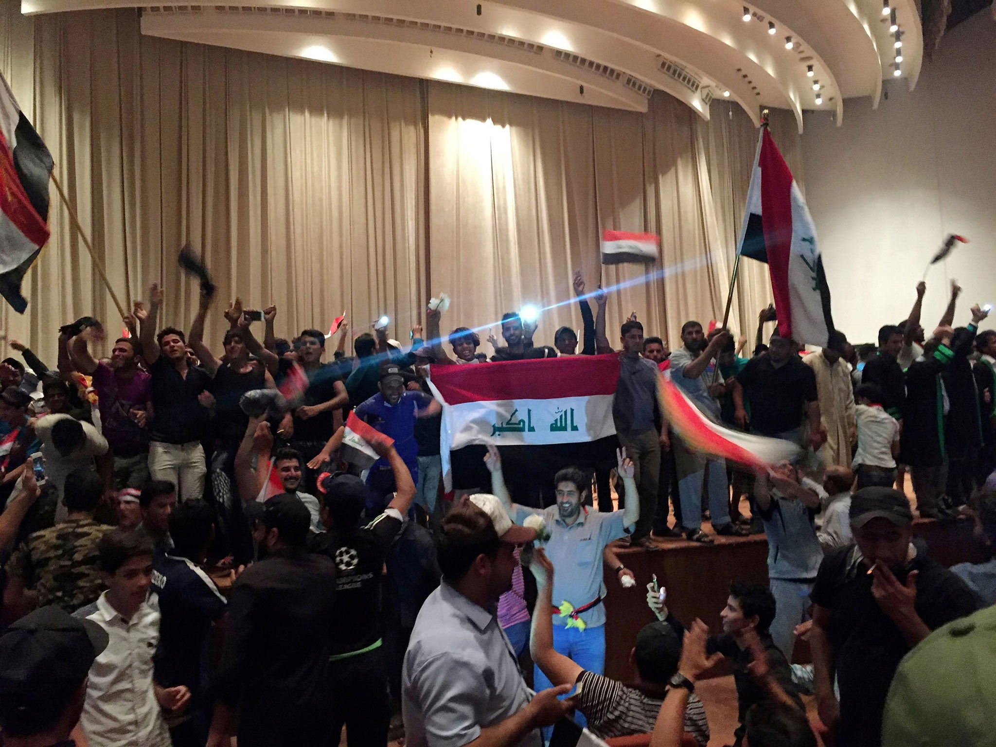 Followers of Shia cleric Moqtada al-Sadr in the parliament building after they stormed Baghdad's Green Zone in Iraq April 30, 2016.