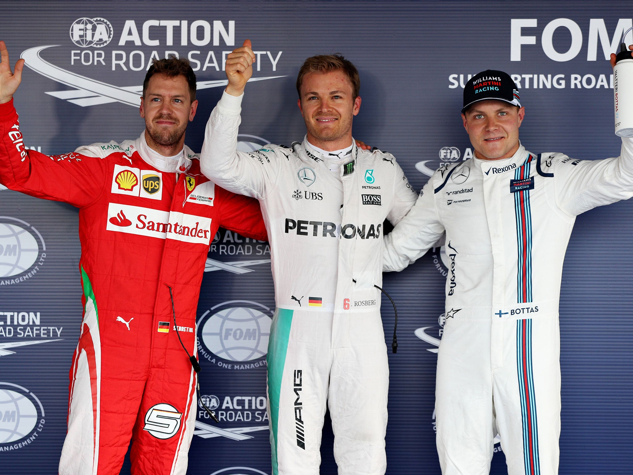 Top three qualifiers, Nico Rosberg of Germany and Mercedes GP, Sebastian Vettel of Germany and Ferrari and Valtteri Bottas of Finland and Williams celebrate