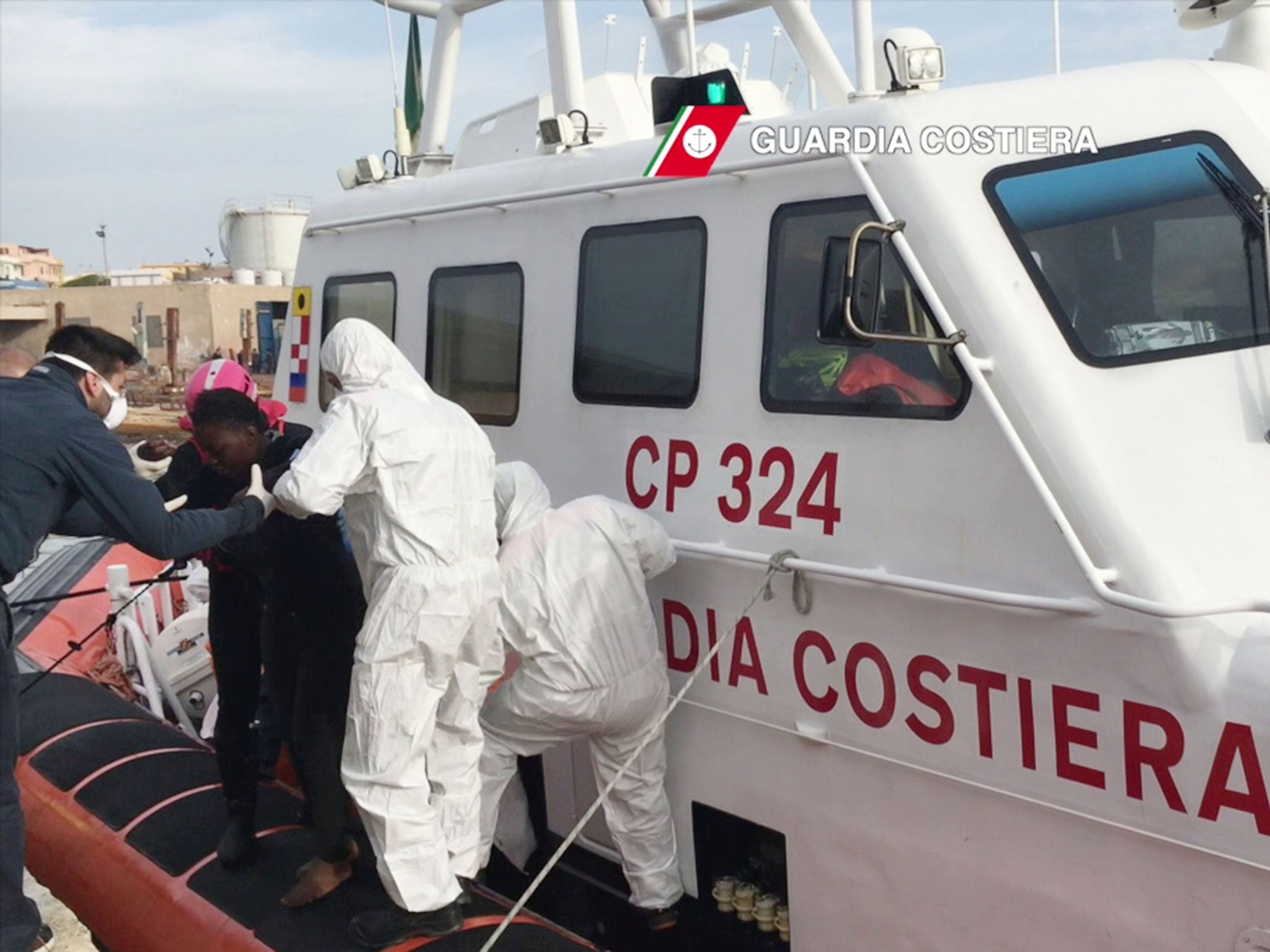 Refugees arrive at the Lampedusa harbour on 30 April 2016 after a rescue operation at sea off the coast of Libya.