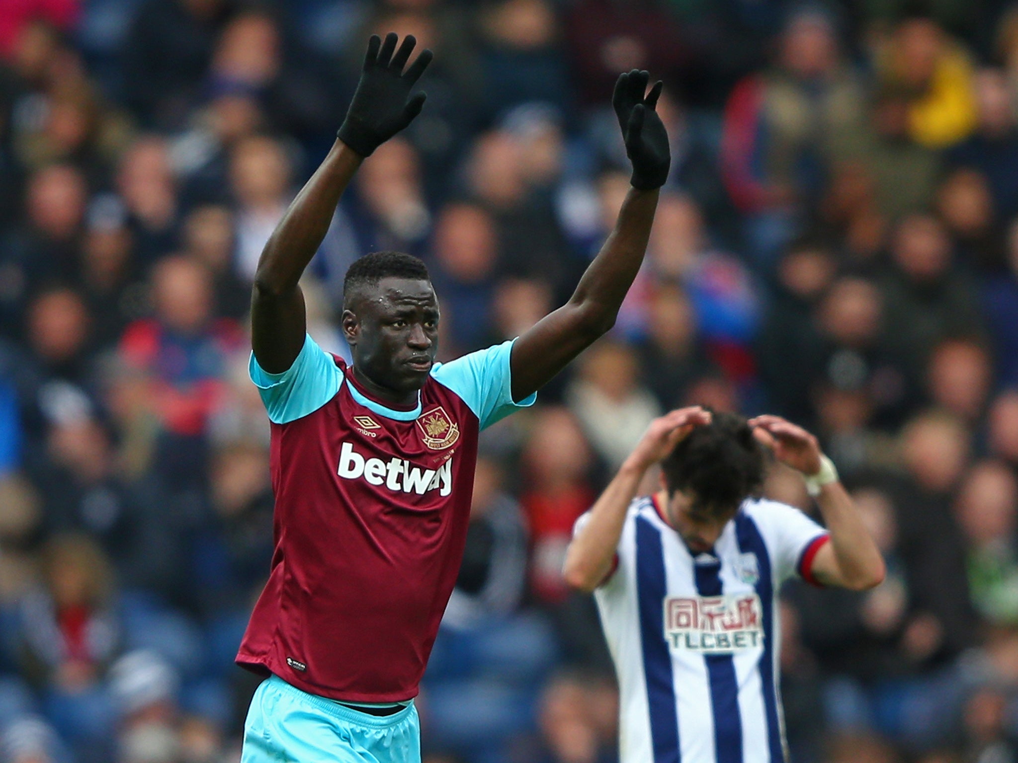 Kouyate celebrates scoring the game's opening goal