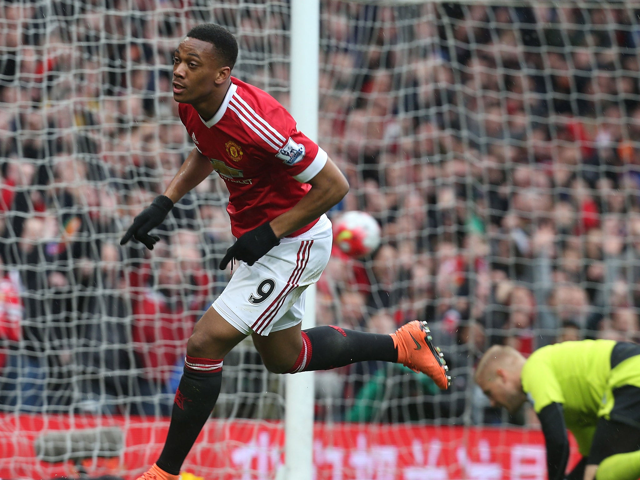 Anthony Martial celebrates scoring the opener against Leicester