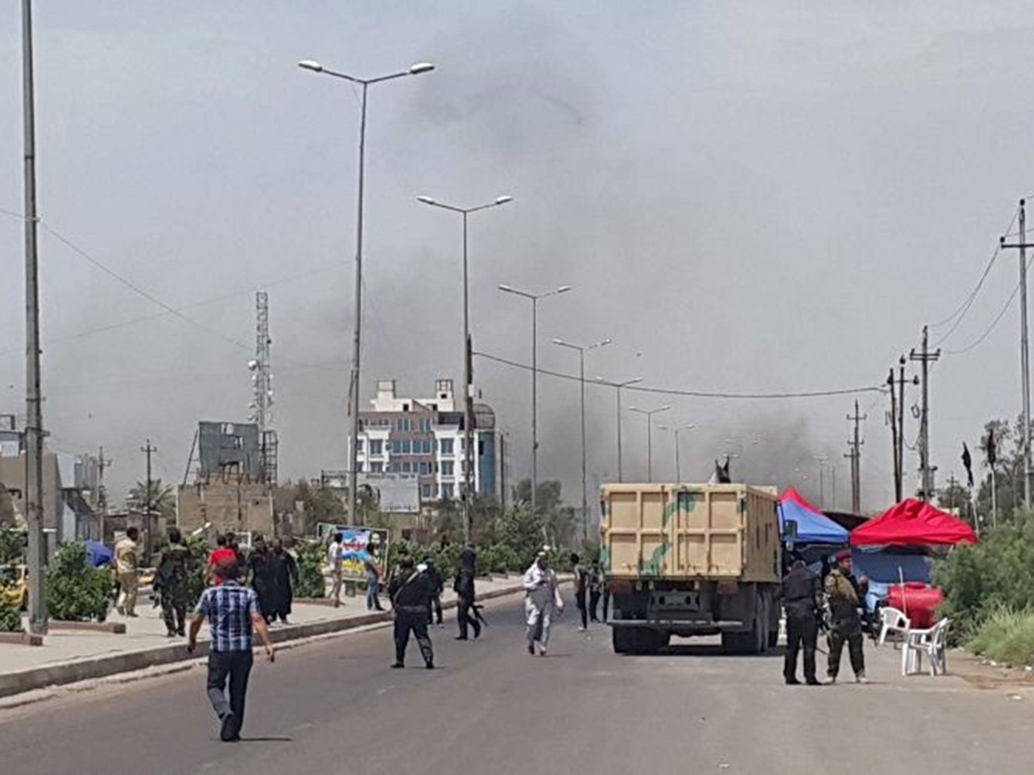 Smoke rises from a car bomb attack in the Saydiya district of southern Baghdad, Iraq, 2 May, 2016