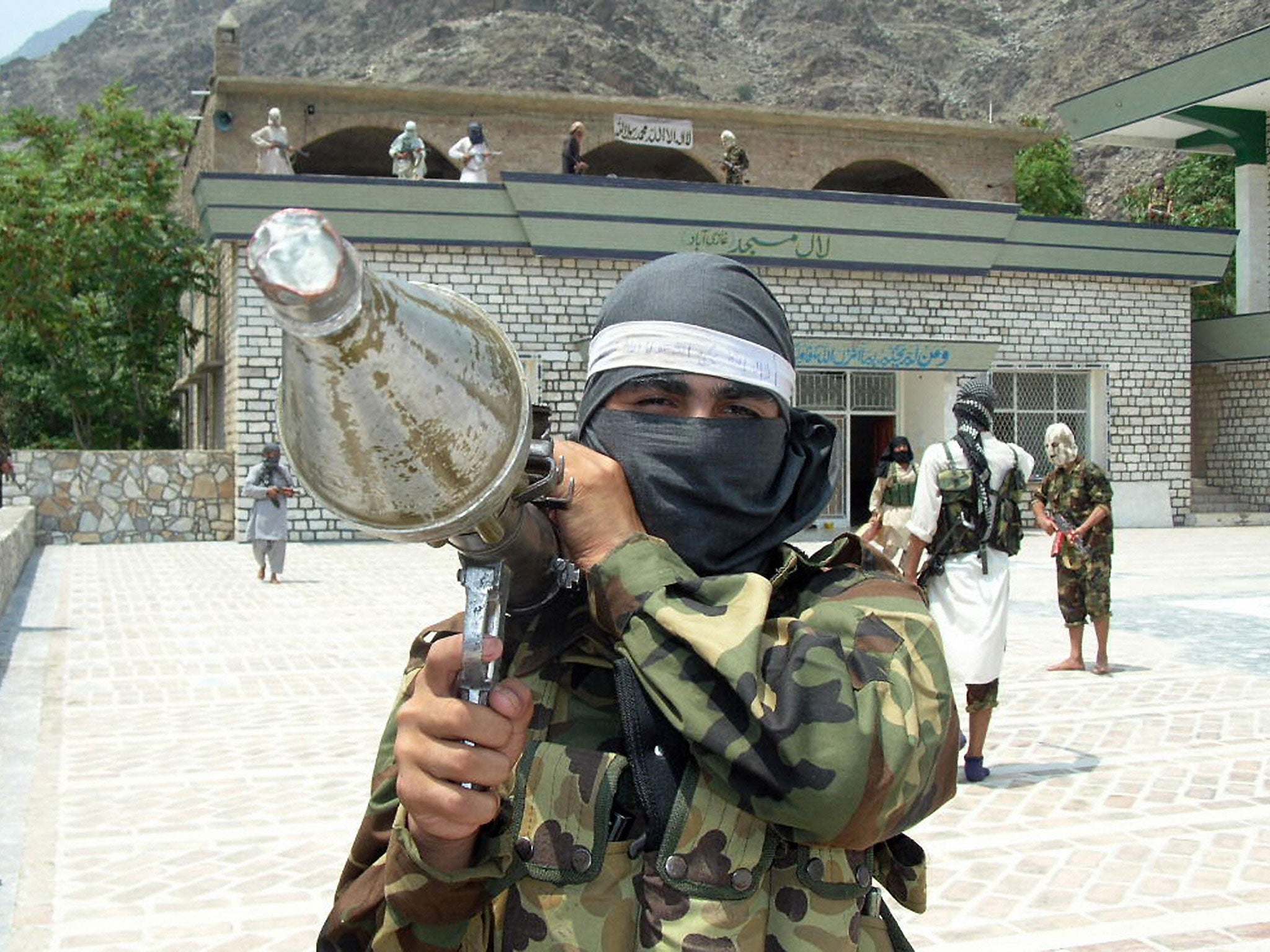 A Taliban militiaman flaunts a rocket propelled grenade launcher on the border of Afghanistan. 15 years after the War on Terror was declared, the militant group are rebuilding their presence