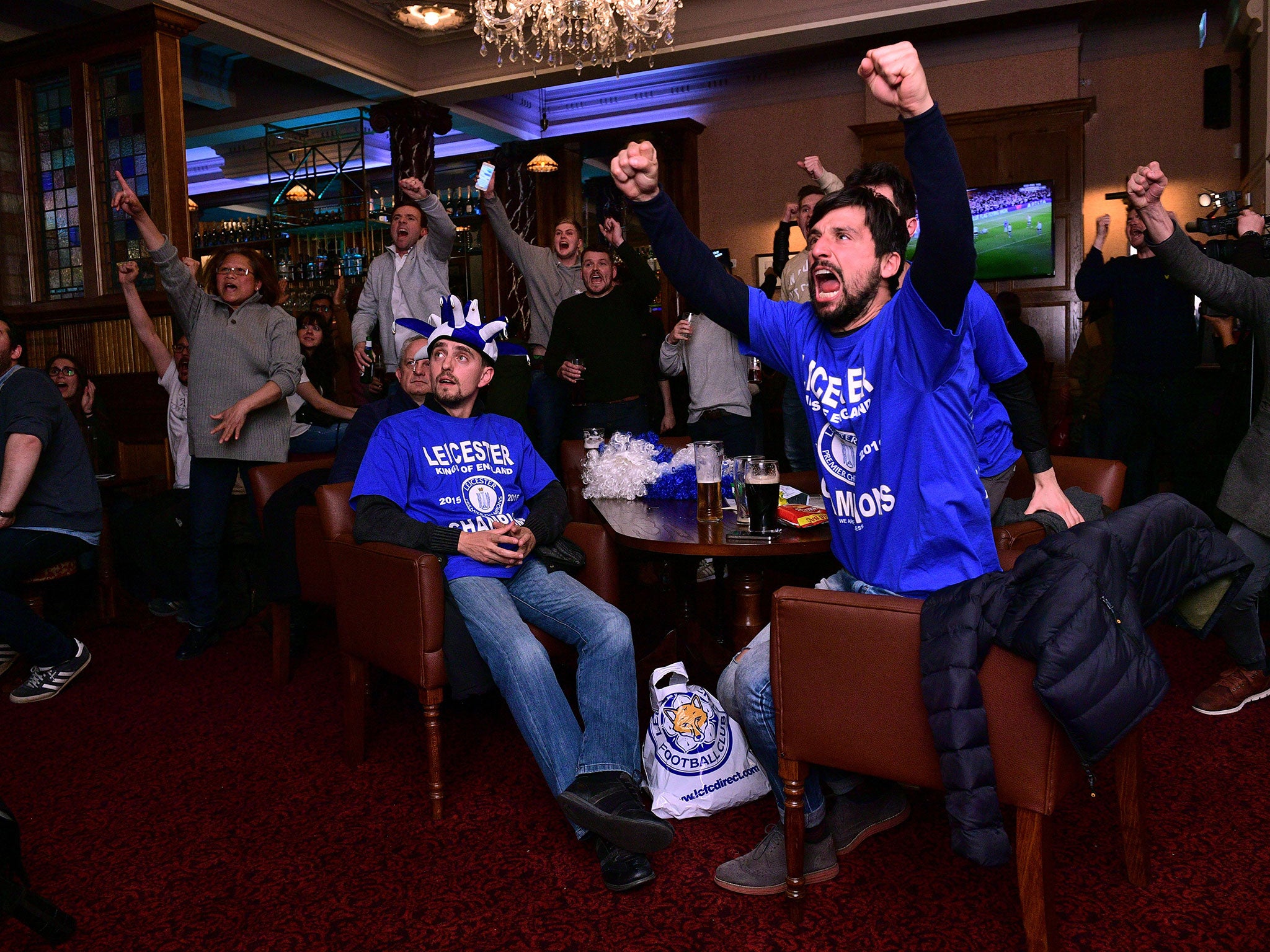 Leicester fans celebrate one of Chelsea's goals