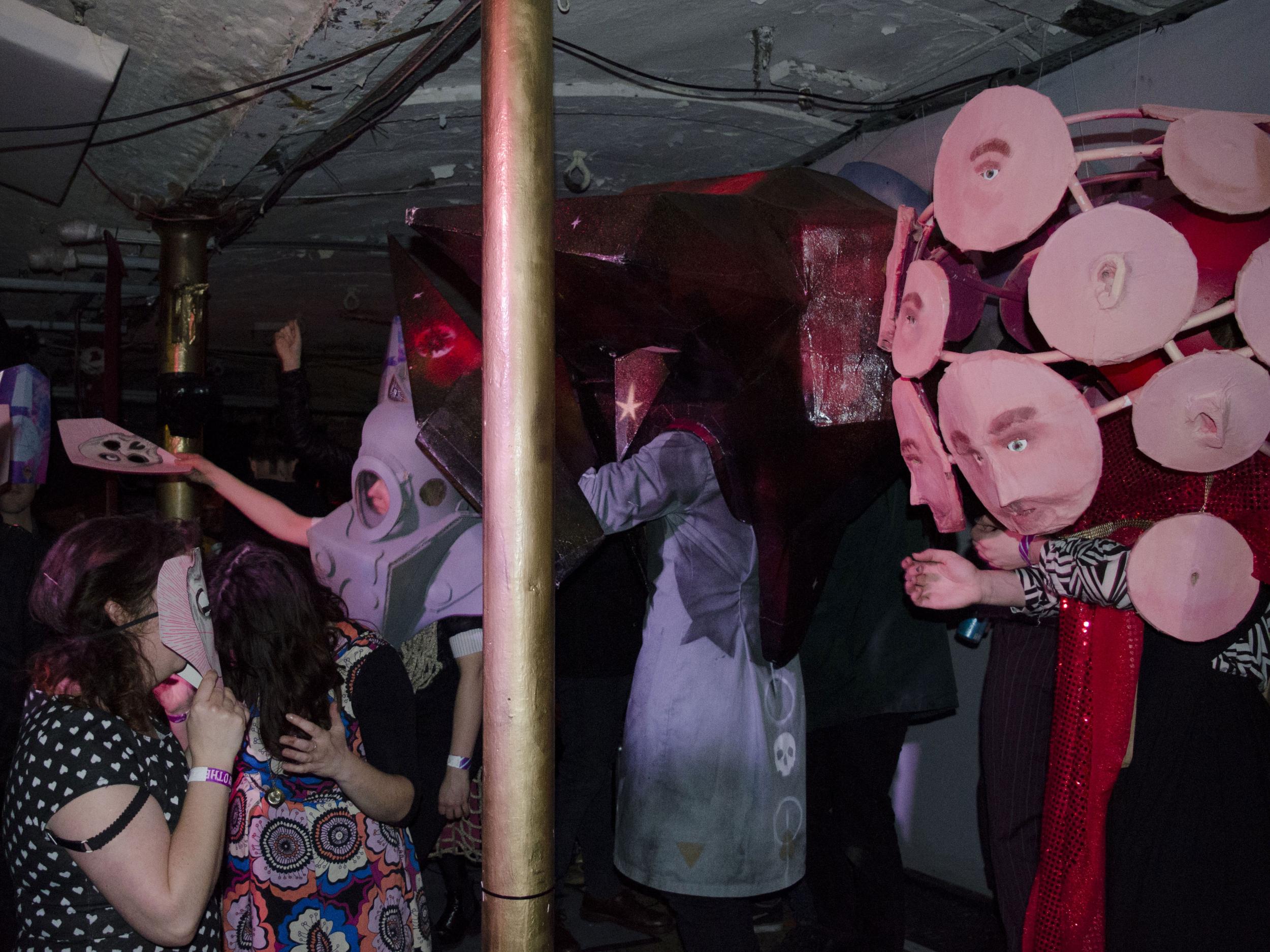 Masks are handed out at the Himhallows masquerade ball at Sounds From The Other City Festival in Salford on May 1, 2016