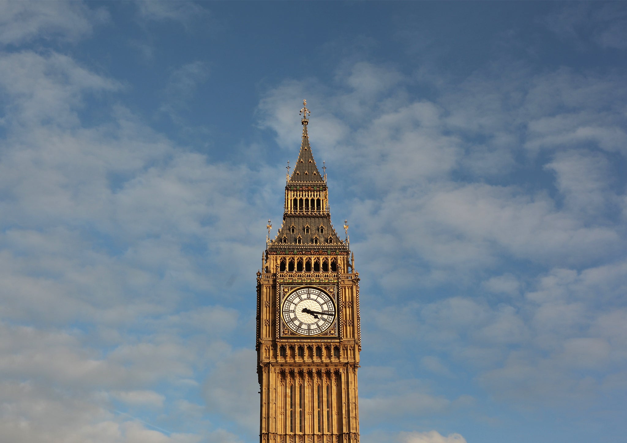 Big Ben is bathed in afternoon sunshine at Parliament on October 22, 2010 in London