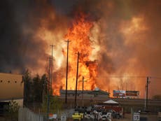 Wildfires spread across more than 1 million acres of US and Canada as California urged to cut energy for fifth time