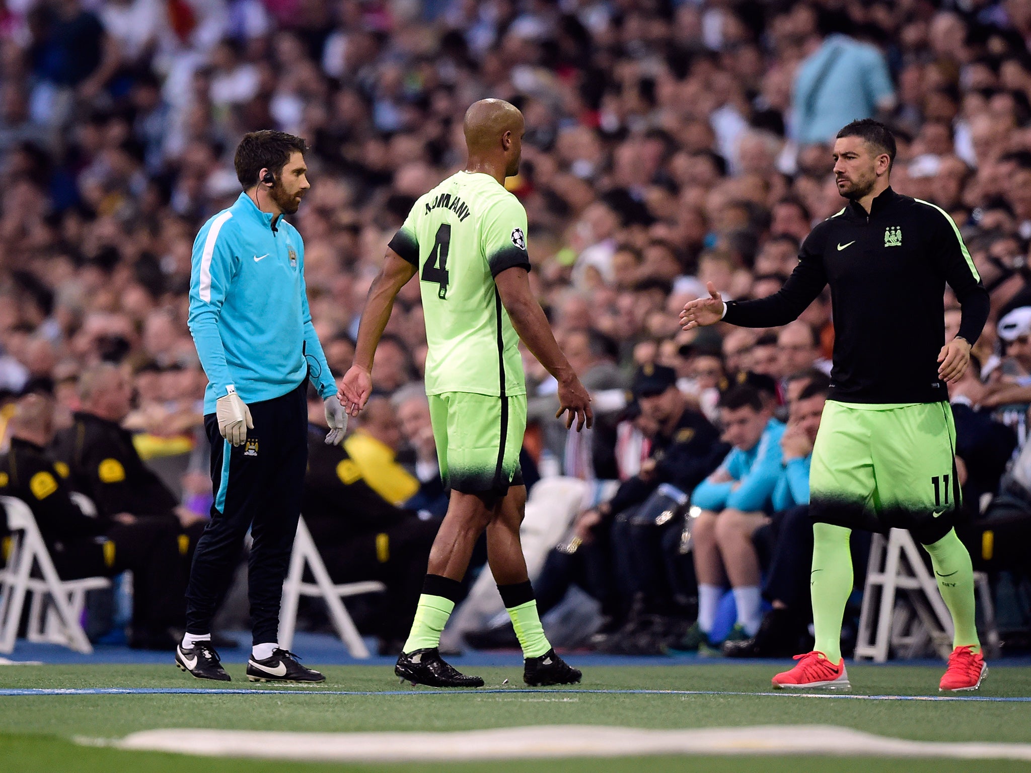 &#13;
Injured Vincent Kompany leaves the field (Getty)&#13;