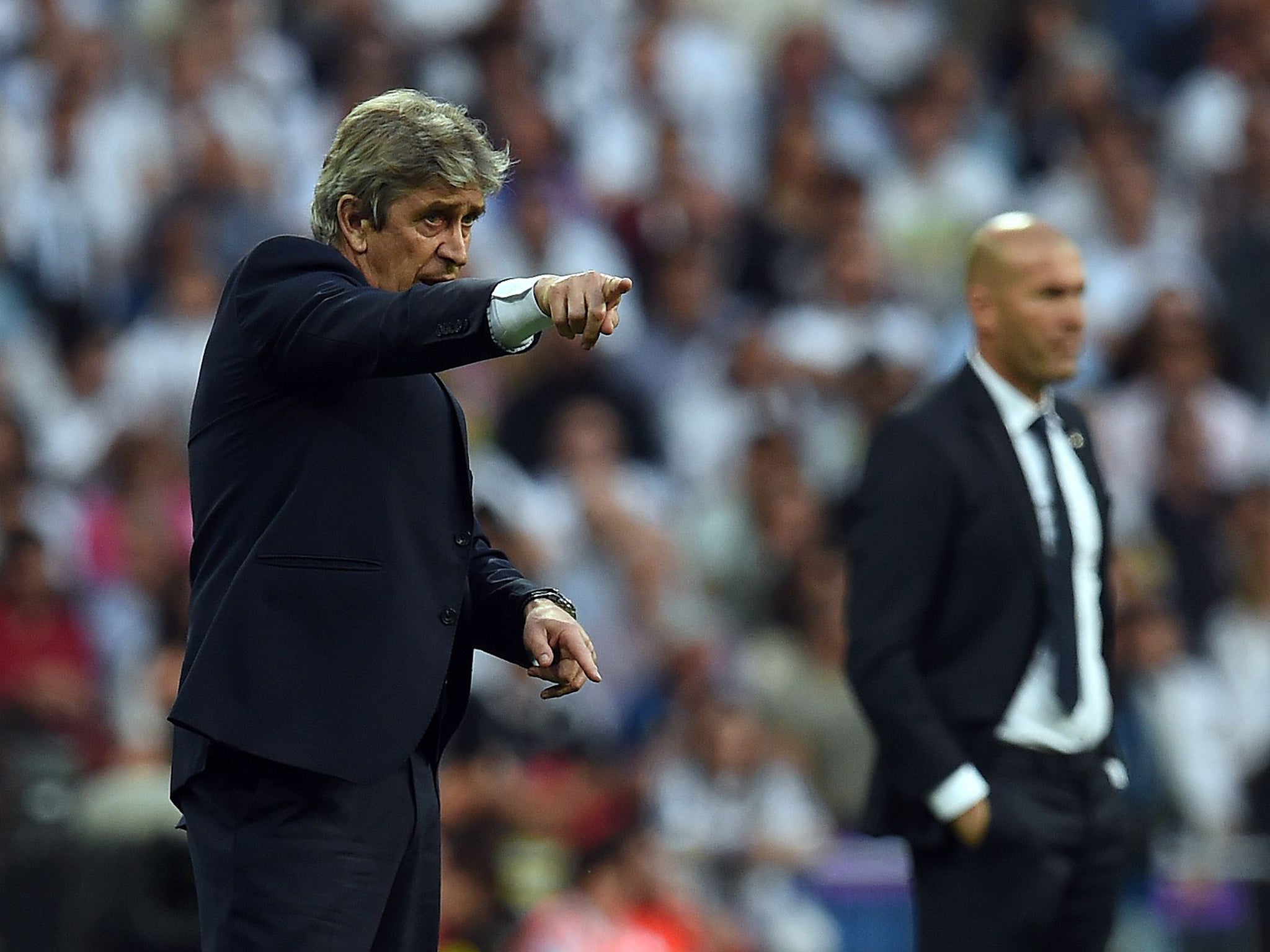 Manuel Pellegrini makes a point on the touchline