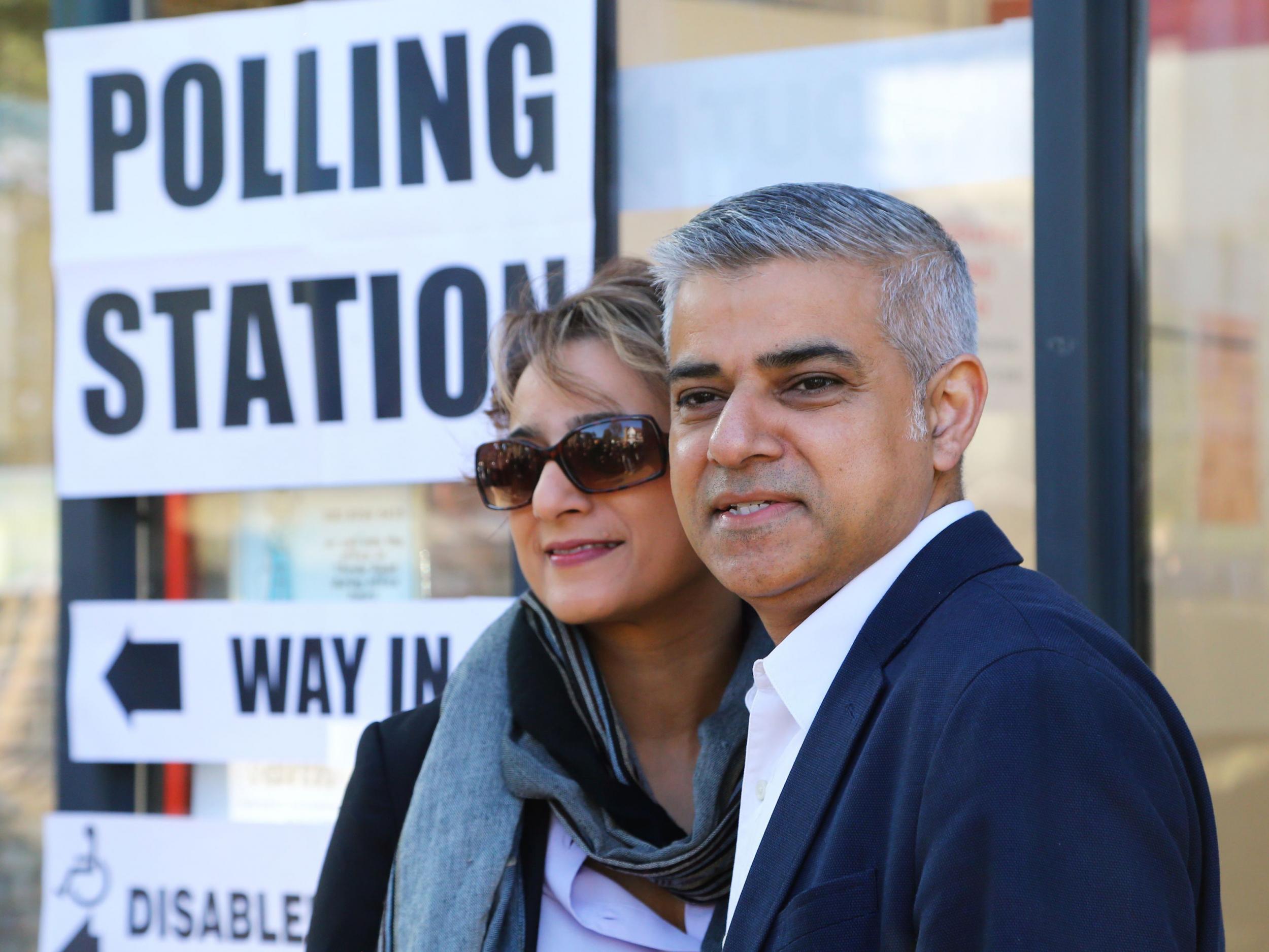 London mayoral candidate Sadiq Khan arrives with his wife Saadiya to cast their votes at a polling station in Streatham, south west London.