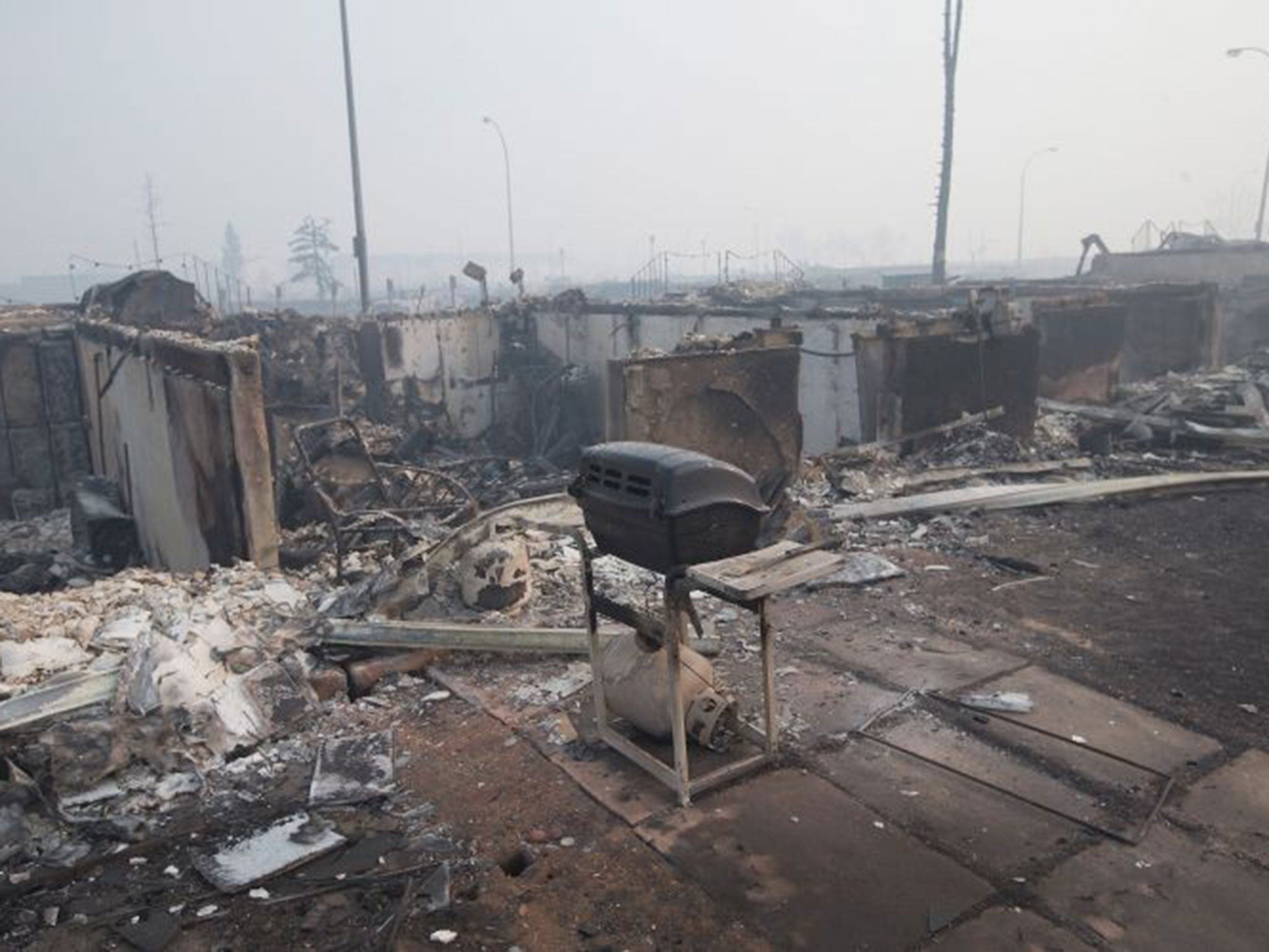 Home foundations are nearly all that remain in a residential neighborhood in Fort McMurray, destroyed by the wildfire in Alberta, Canada