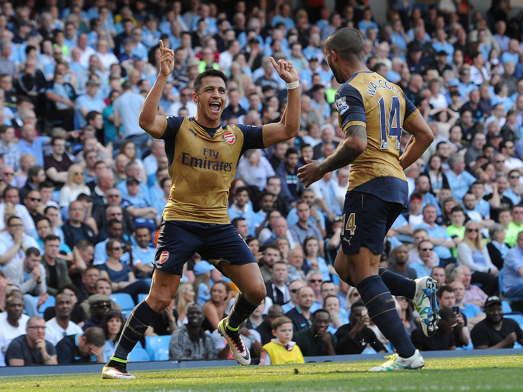 Alexis Sanchez celebrates making it 2-2 with Theo Walcott