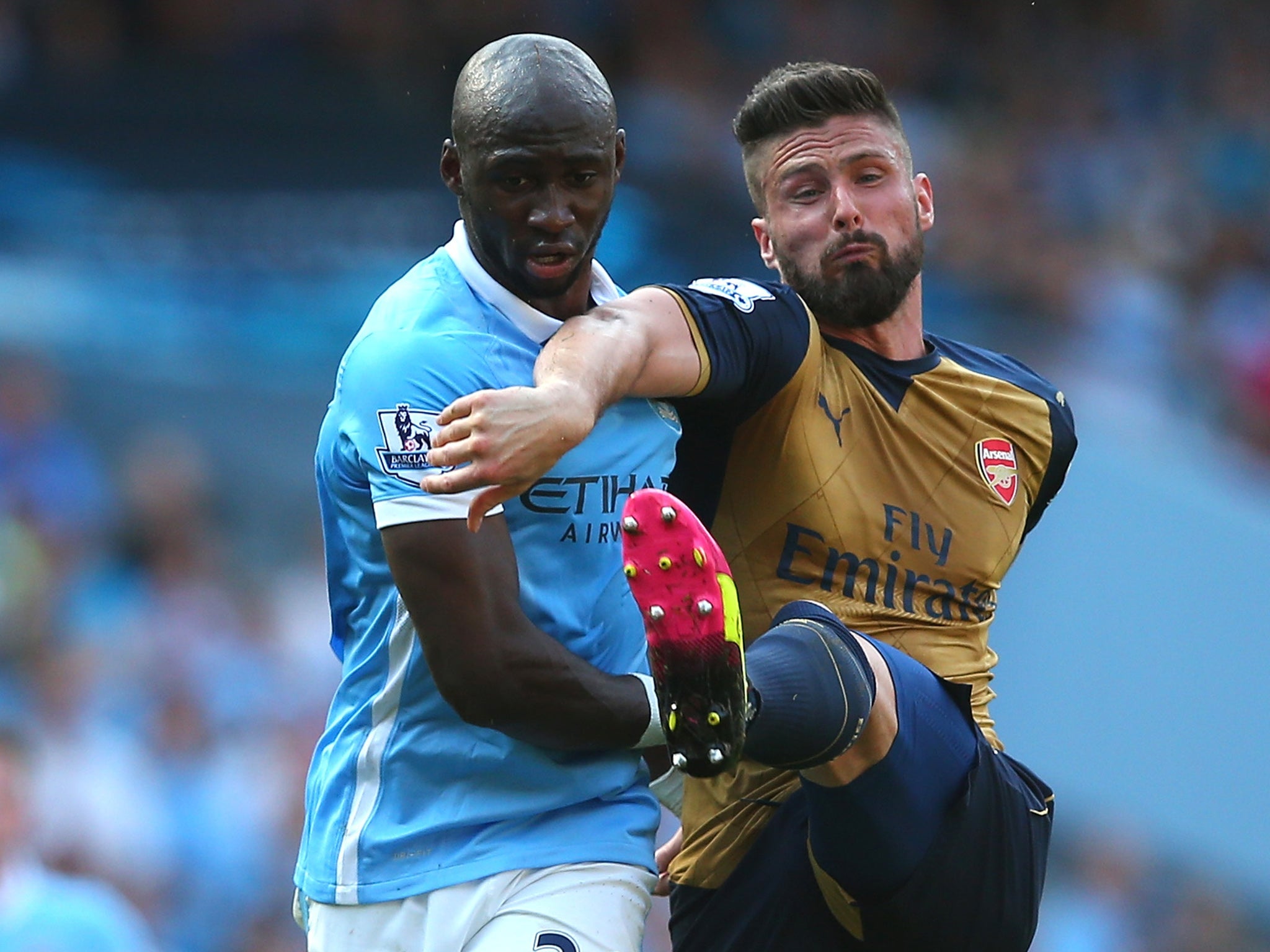 Mangala tussles with Arsenal's Olivier Giroud during a Premier League match last season