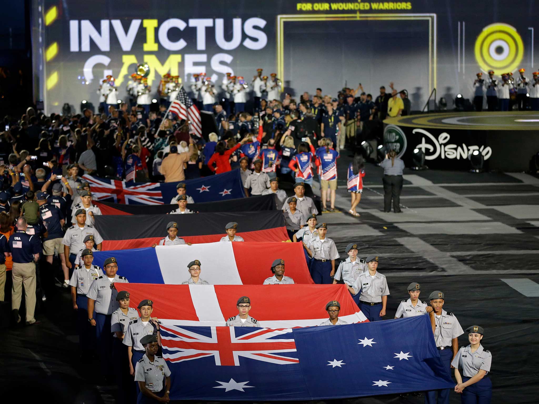 Flags of some of the participating nations are displayed during the opening ceremony for the Invictus Games in Kissimmee