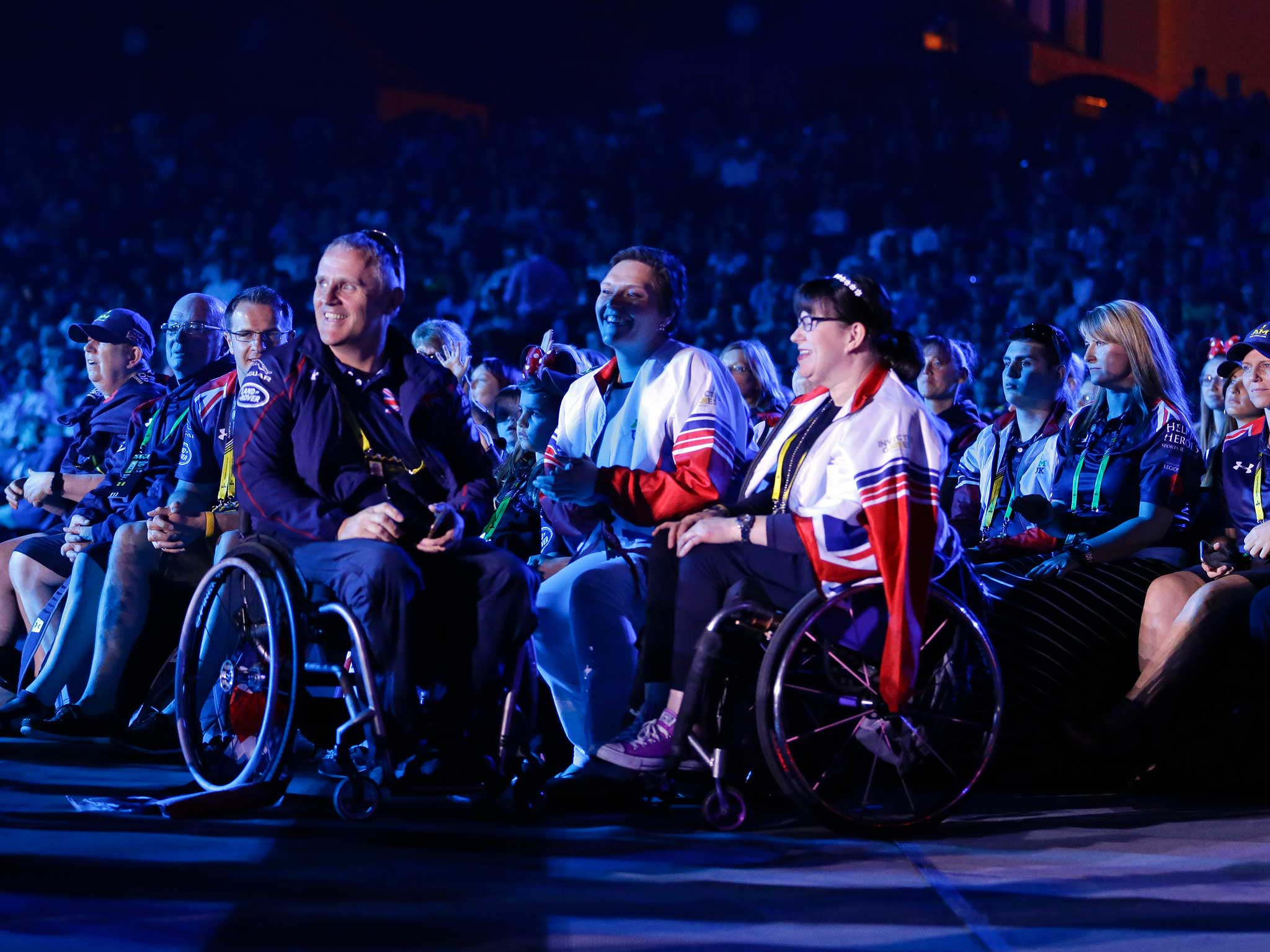 Athletes and their families watch a musical performance during the opening ceremony for the Invictus Games