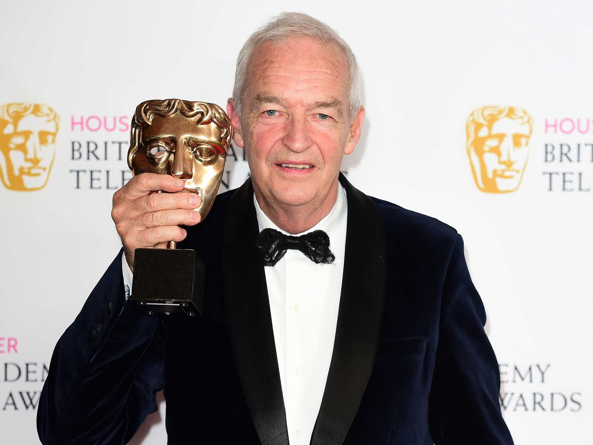 Jon Snow collects the award for best news coverage on behalf of Channel 4 during the House of Fraser BAFTA TV Awards 2016 at the Royal Festival Hall in London