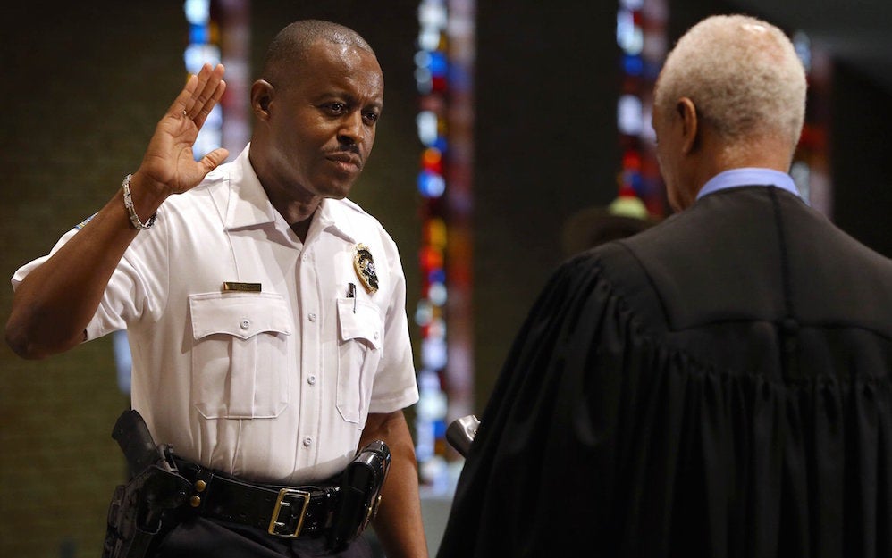 &#13;
Delrish Moss is sworn by Judge Donald McCullin at the Ferguson Community Center. David Carson/St Louis Post-Dispatch/Associated Press&#13;