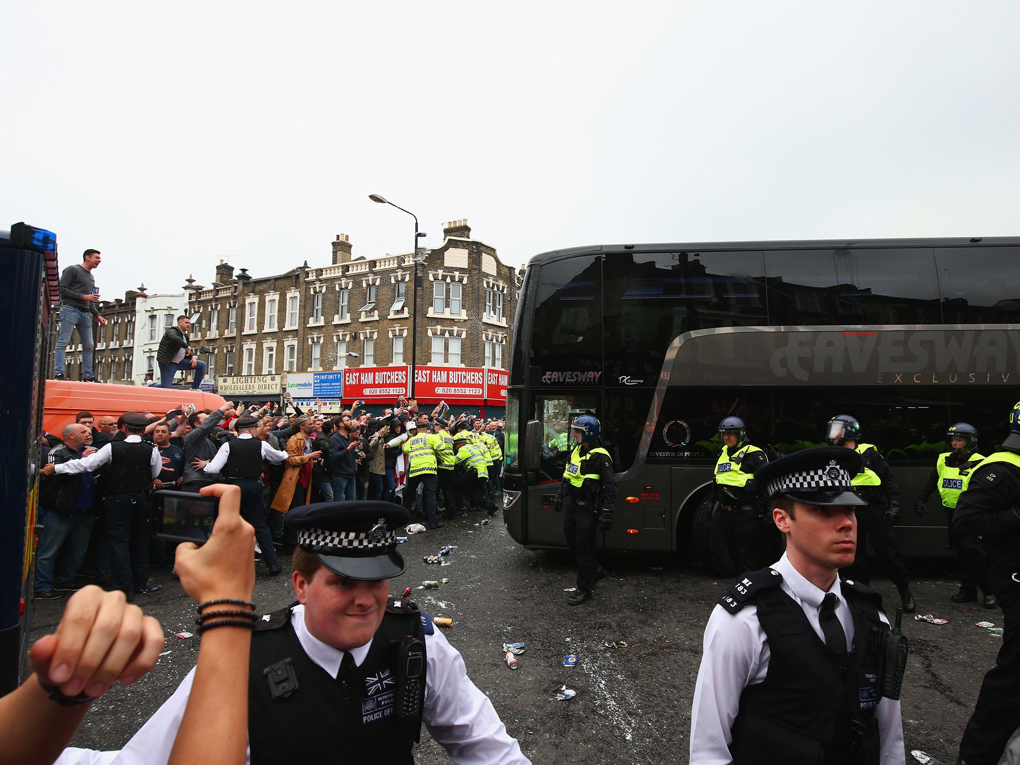 Police surround the bus as it is attacked (Getty)