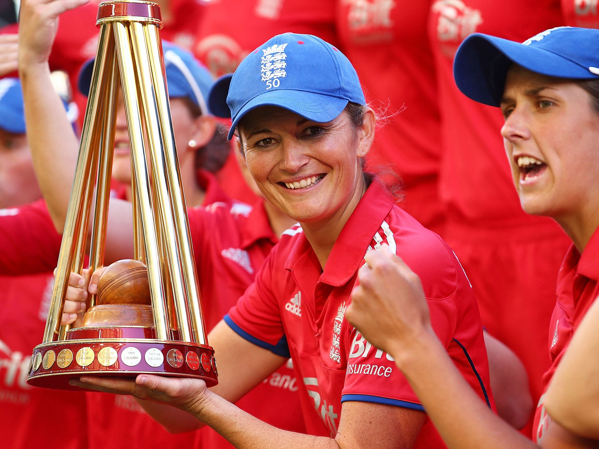 Charlotte Edwards poses with the Ashes trophy after winning the 2014 series