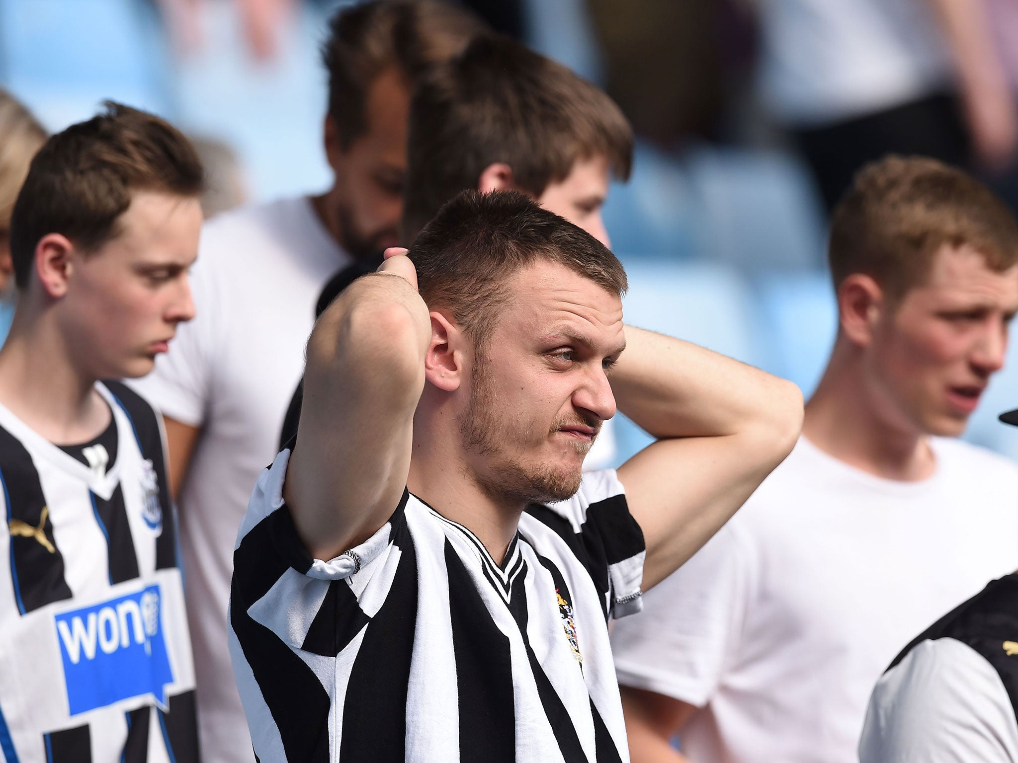 Dejected looking Newcastle fans