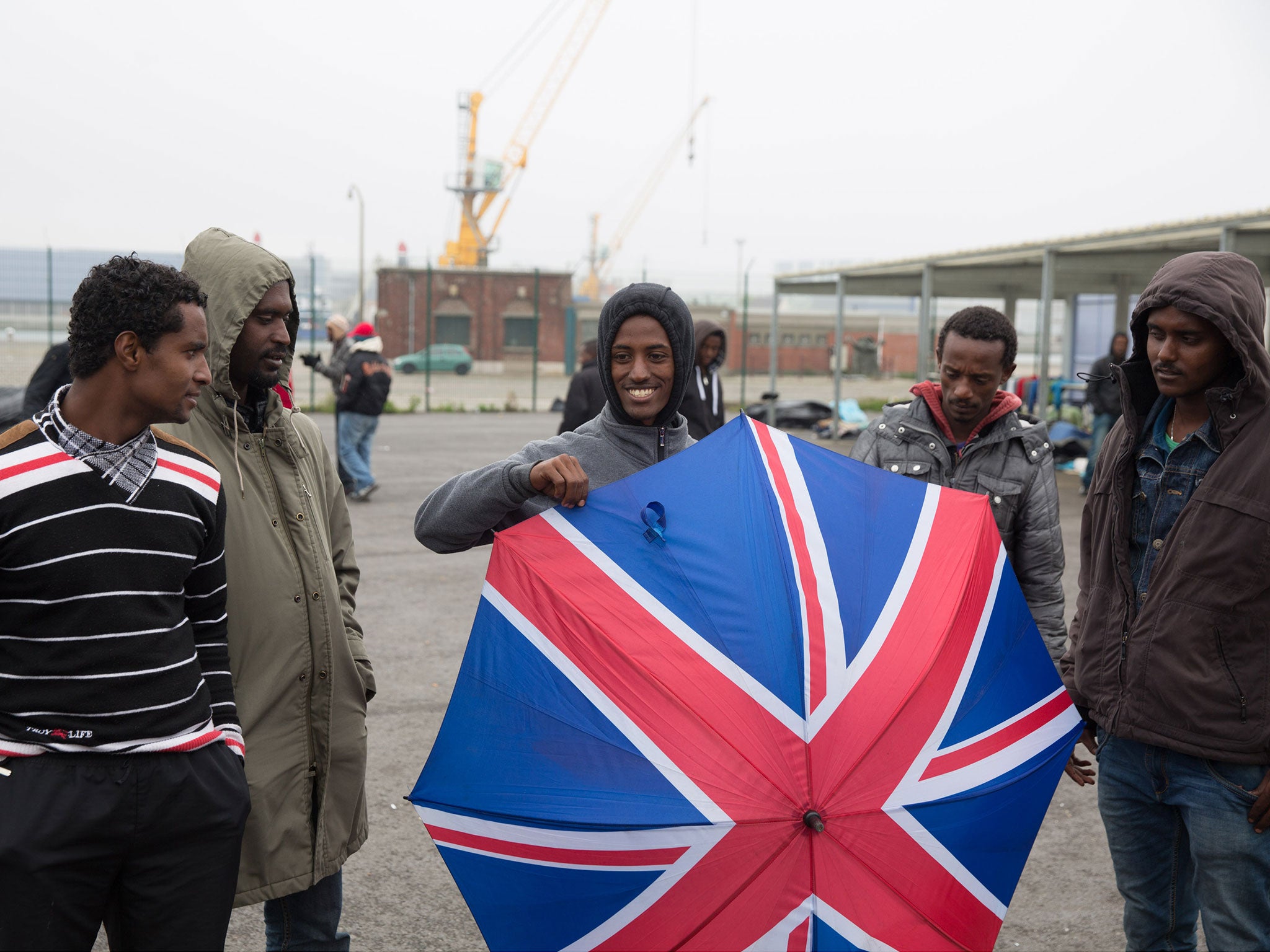 Migrants wait in Calais hoping to evade security and cross the Channel. Many are trying to re-connect with relatives while others are searching for a better standard of life