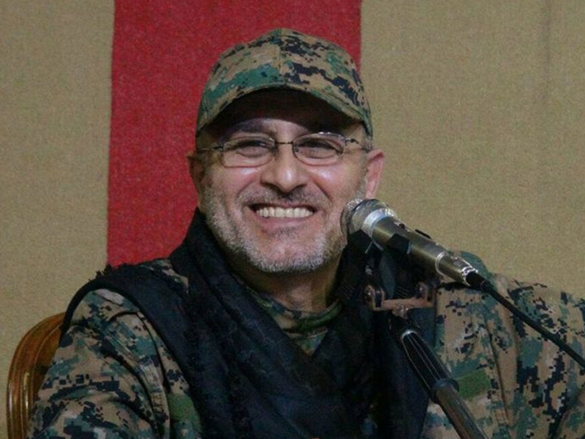 This undated handout image released on Friday, 13 May, 2016, by Hezbollah Media Department, shows slain top military commander Mustafa Badreddine smiling during a meeting