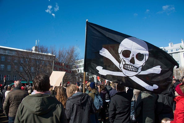 A Pirate Party flag at a rally in Reykjavik following the Prime Minister's implication in tax evasion via the Panama Papers (HALLDOR KOLBEINS/AFP/Getty Images)