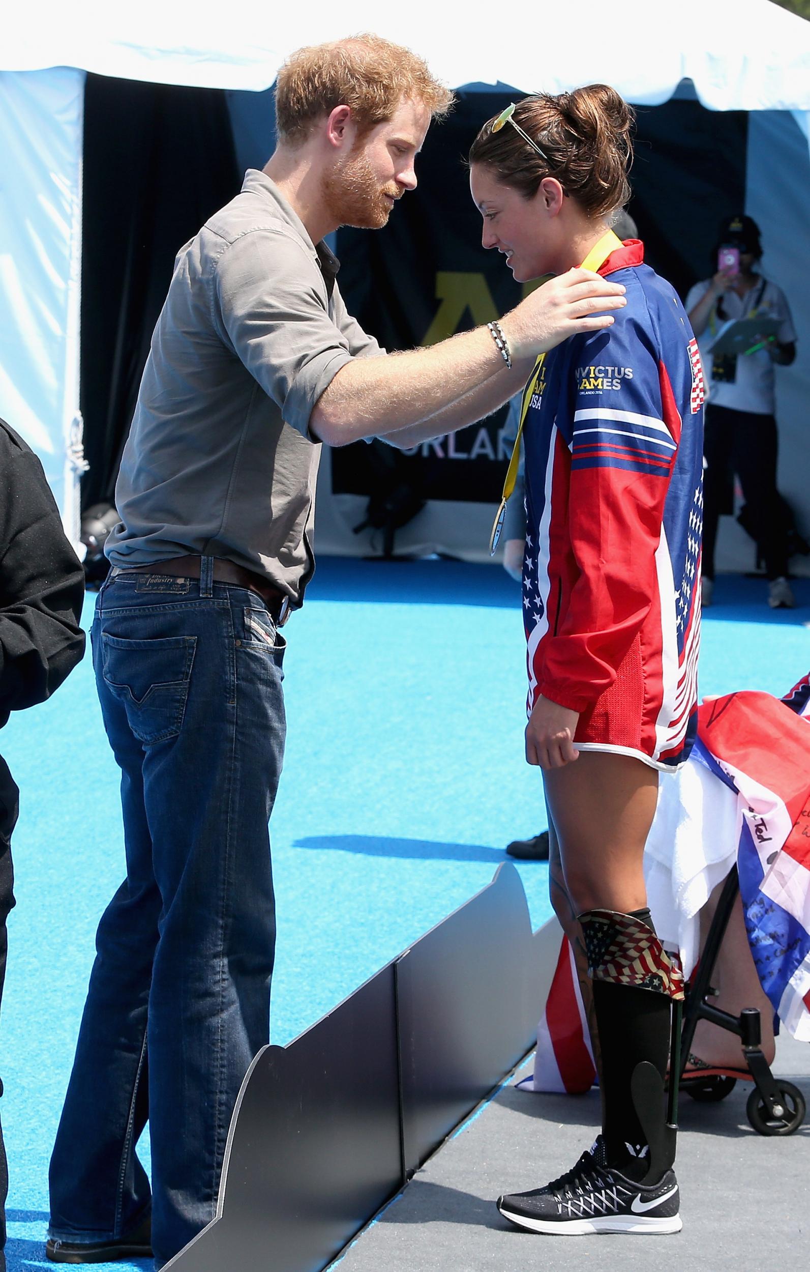 Sgt Marks receives a gold medal from Prince Harry