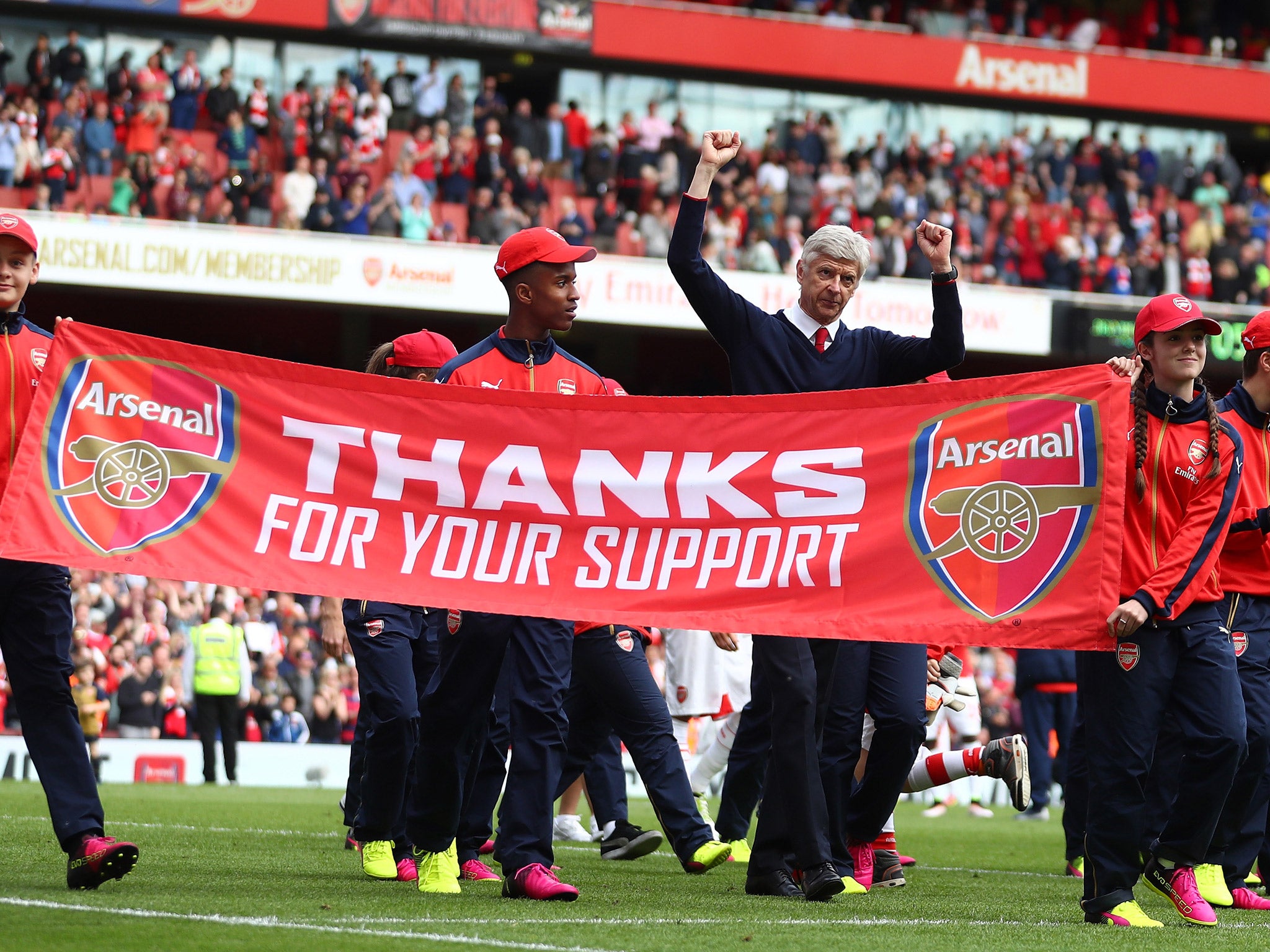 Arsene Wenger celebrates after the 4-0 win over Aston Villa to clinch second place for Arsenal