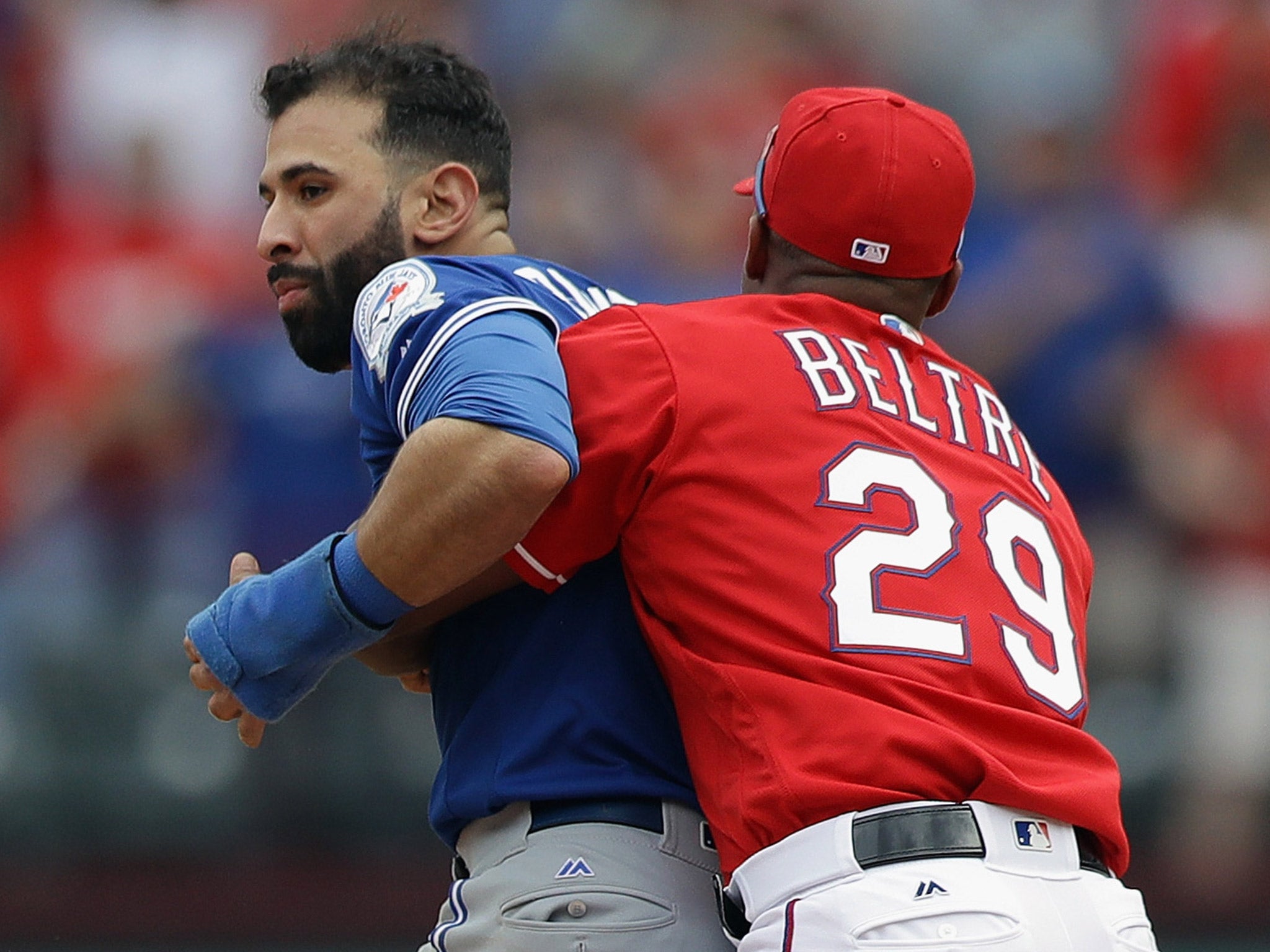 Adrian Beltre grabs Bautista to prevent him from retaliating