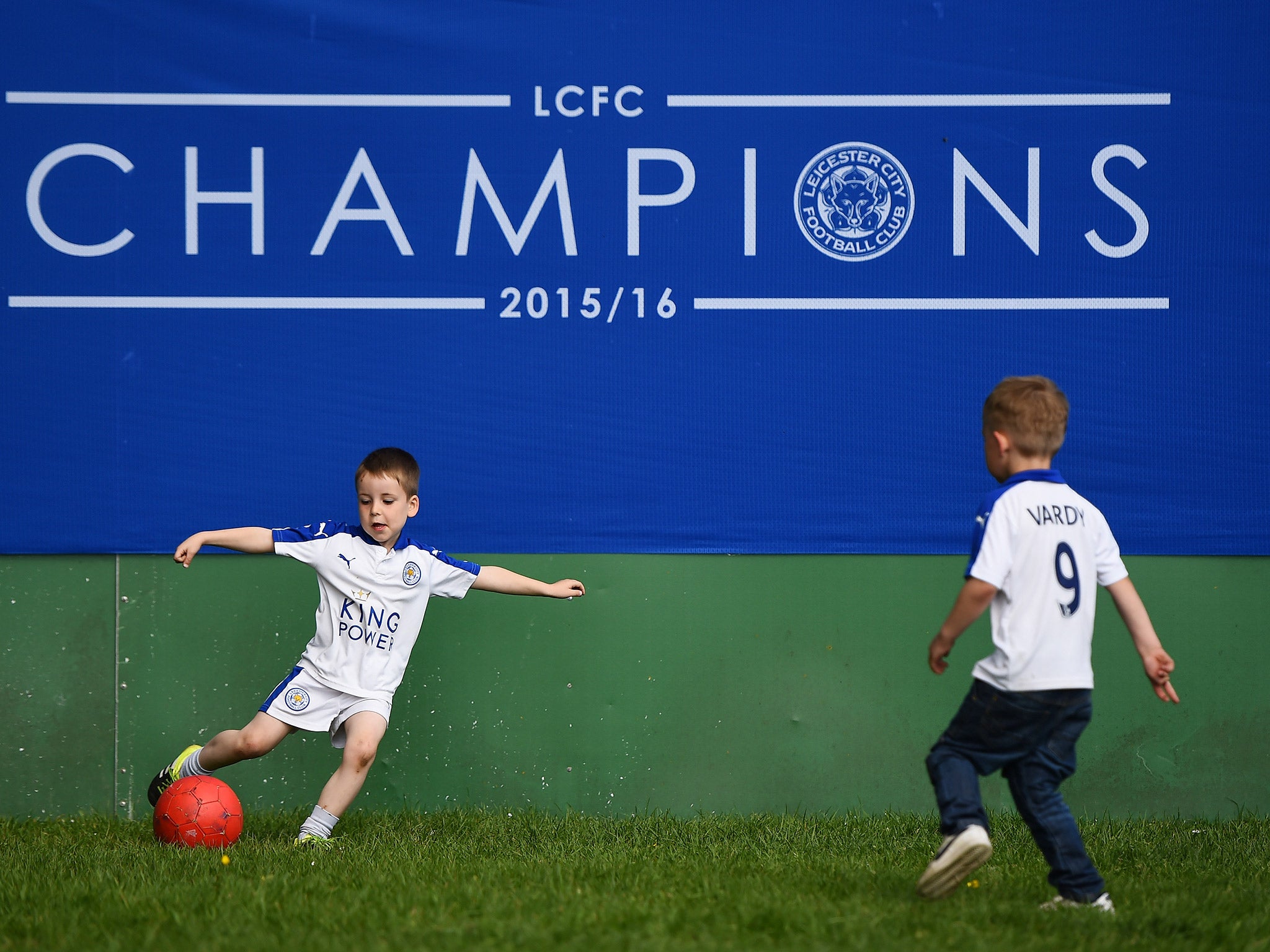 Young Leicester fans enjoy a kick-a-bout before the parade.