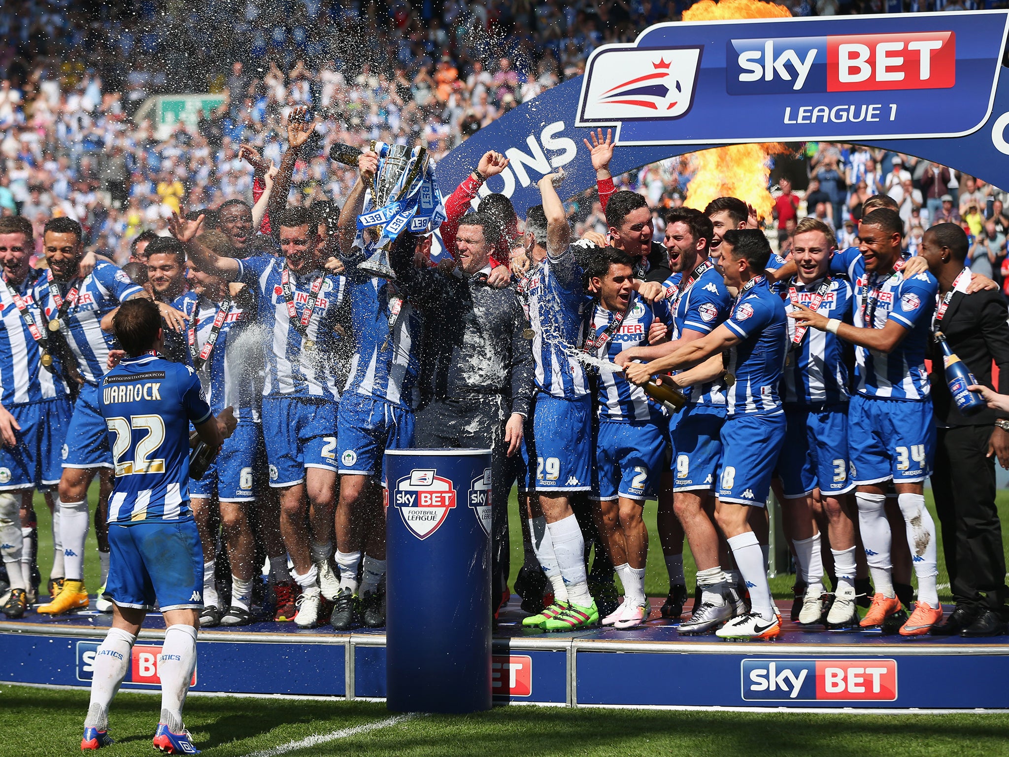 Wigan celebrate lifting the League One title at the DW Stadium