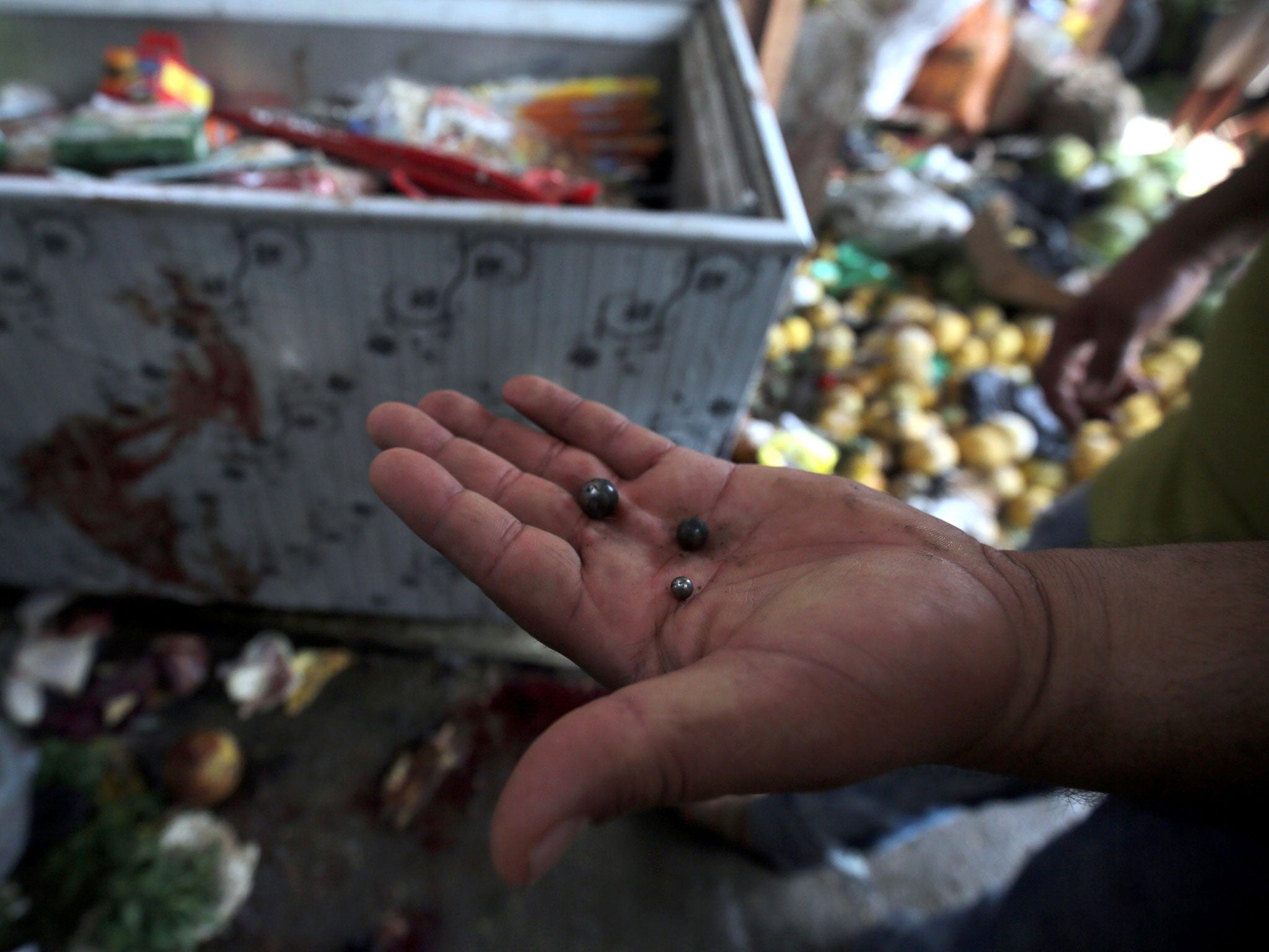 Metal pellets were found at the site of a suicide bombing in al-Shaab (AFP/Getty)