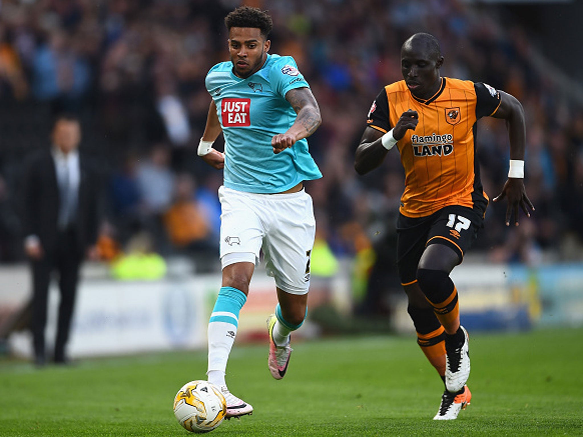 Derby's Cyrus Christie and Hull midfielder Mo Diame battle for possession at the KC Stadium (Getty)