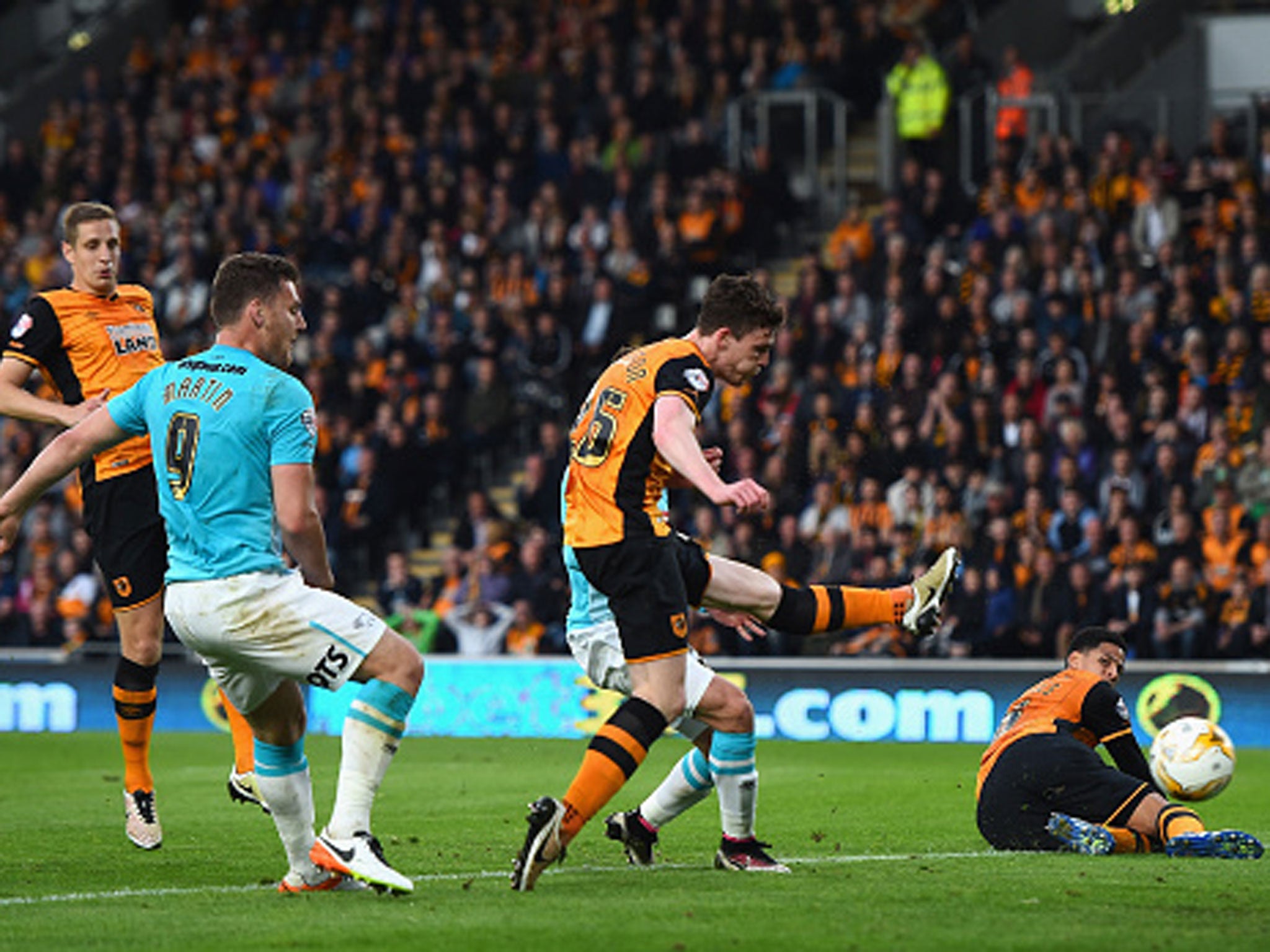 Andy Robertson puts through his own net to put Derby two goals ahead on the night, but the Tigers hung on (Getty)