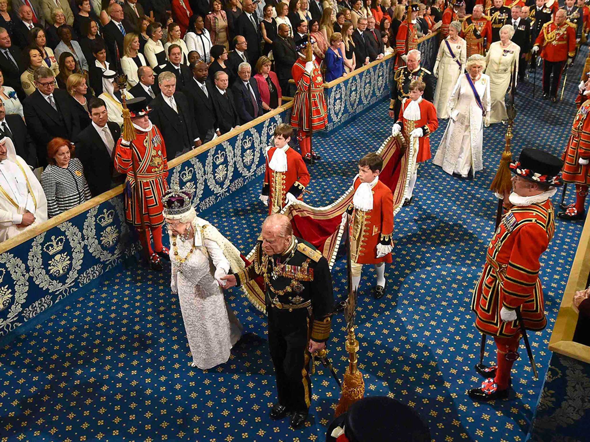 Queen Elizabeth II and Prince Philip proceed through the Royal Gallery in the Houses of Parliament