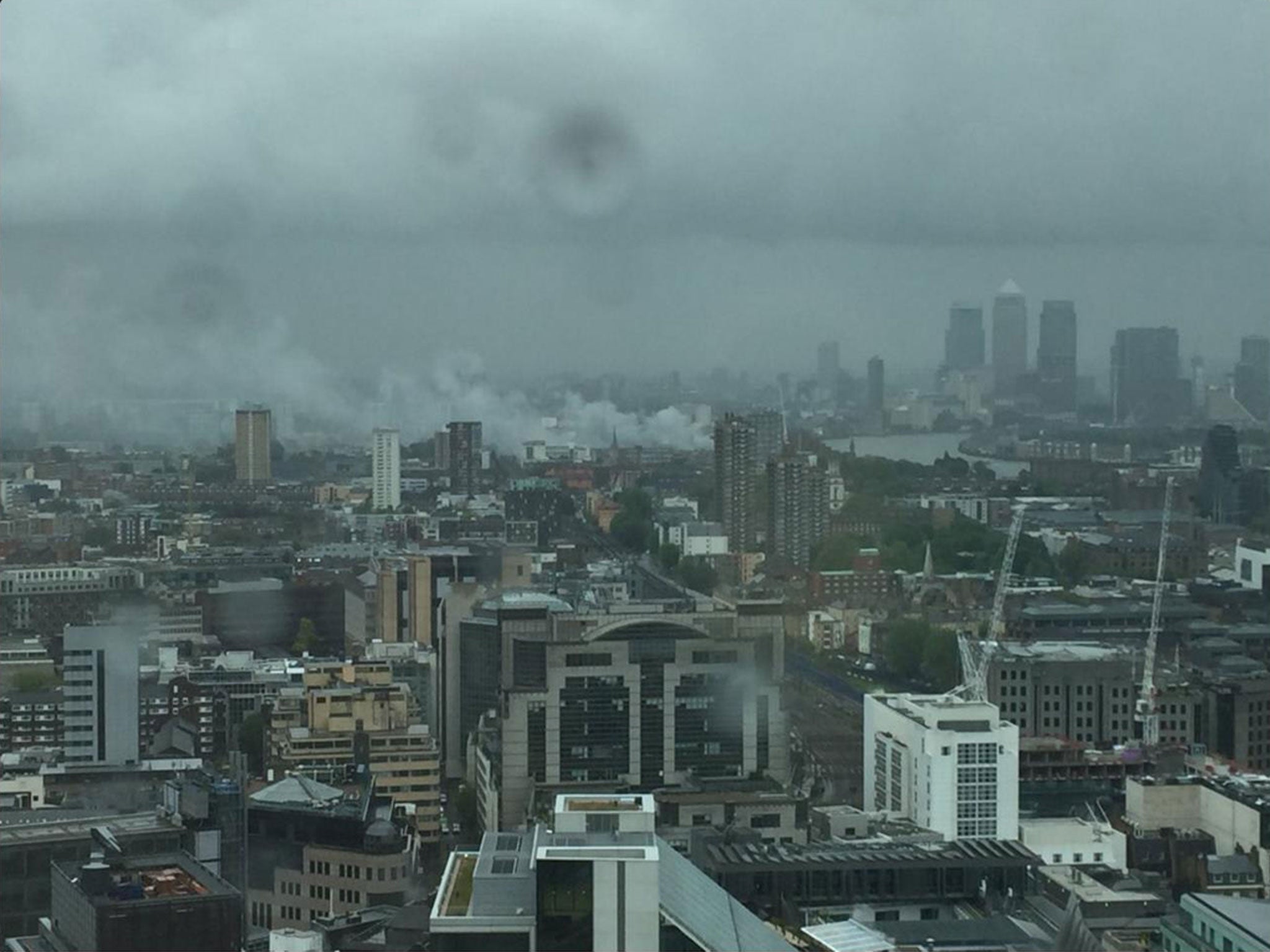 A fire at a builders' yard in Wapping viewed from central London on 18 May 2016