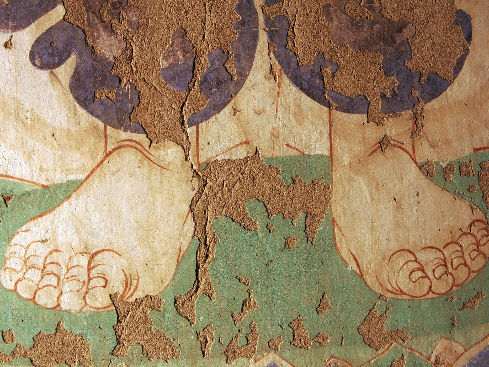 &#13;
A crumbling, 1,000-year-old Buddhist fresco from inside in the Mogao Grottoes &#13;