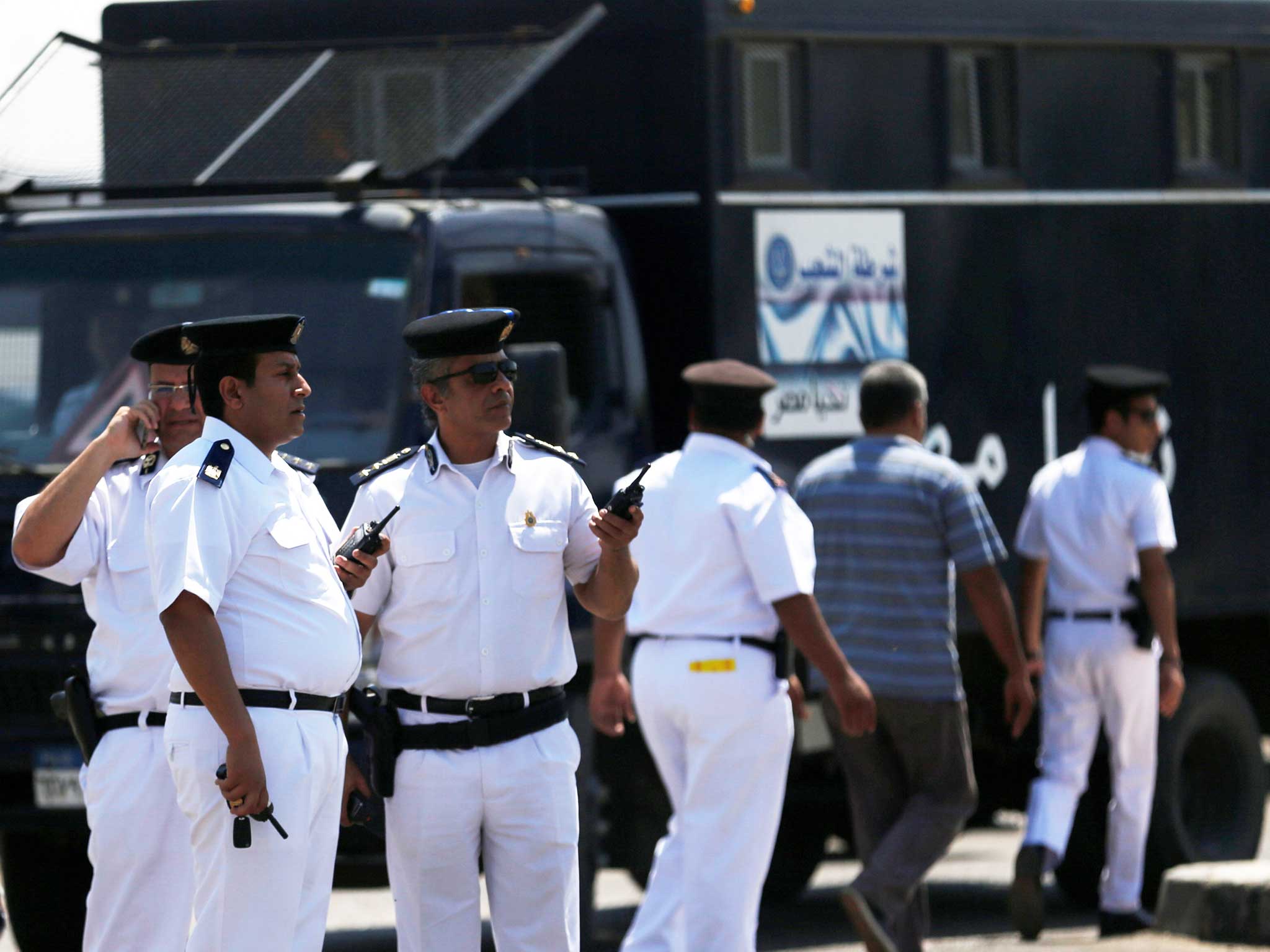 Security personnel are seen outside an Egyptair in-flight service building at Cairo International Airport