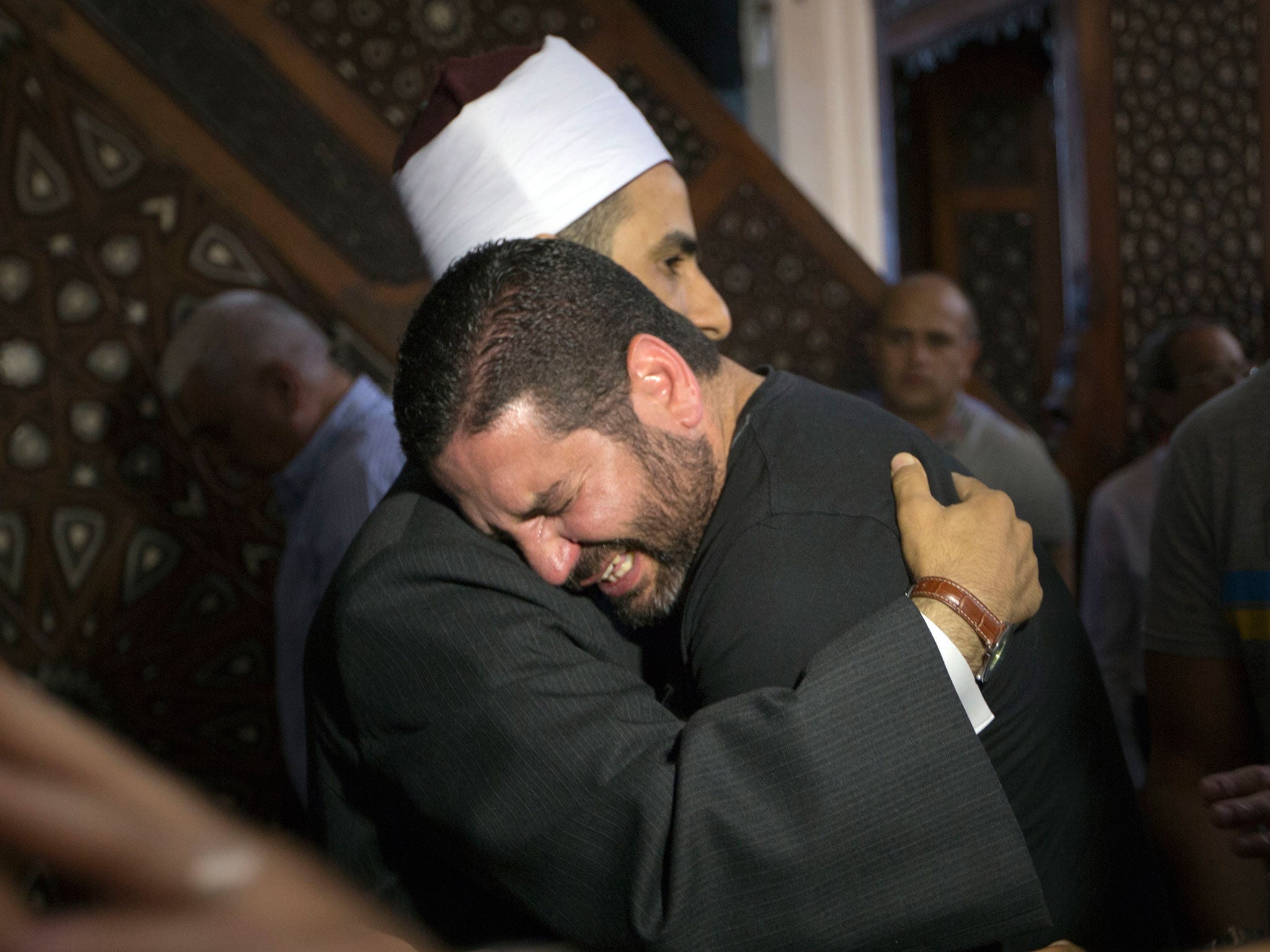 Relatives unable to hold funerals for their loved ones said prayers at mosques in Cairo