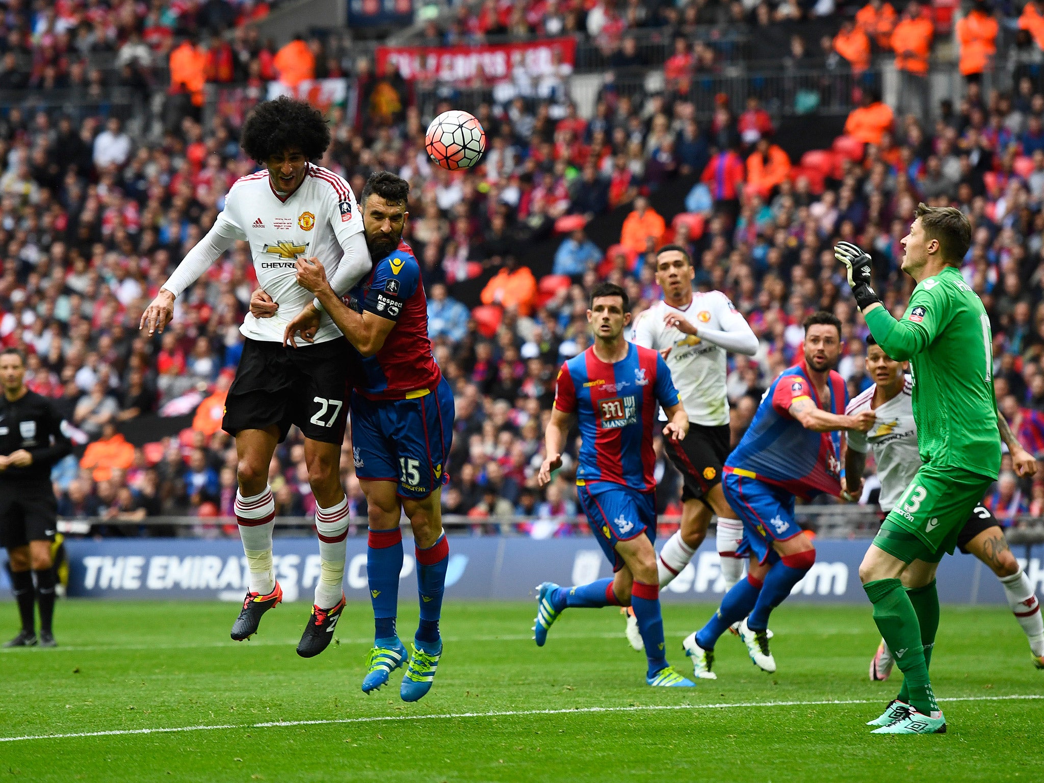 Marouane Fellaini has a header at goal during the FA Cup final