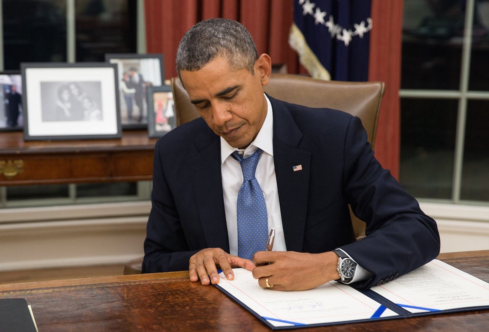 President Obama flexes his signature.