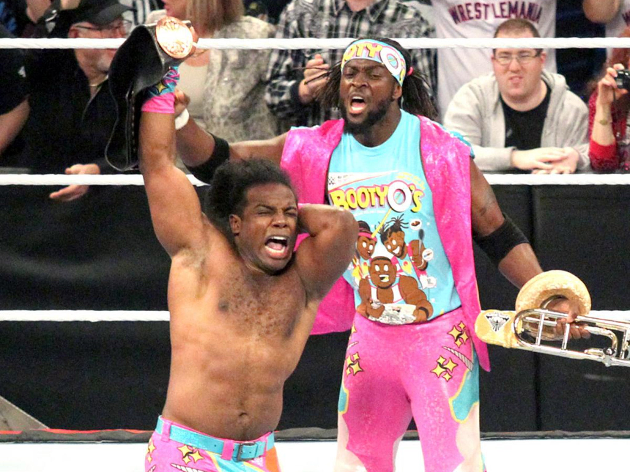 Xavir Woods and kofi Kingston celebrate The New Day's victory