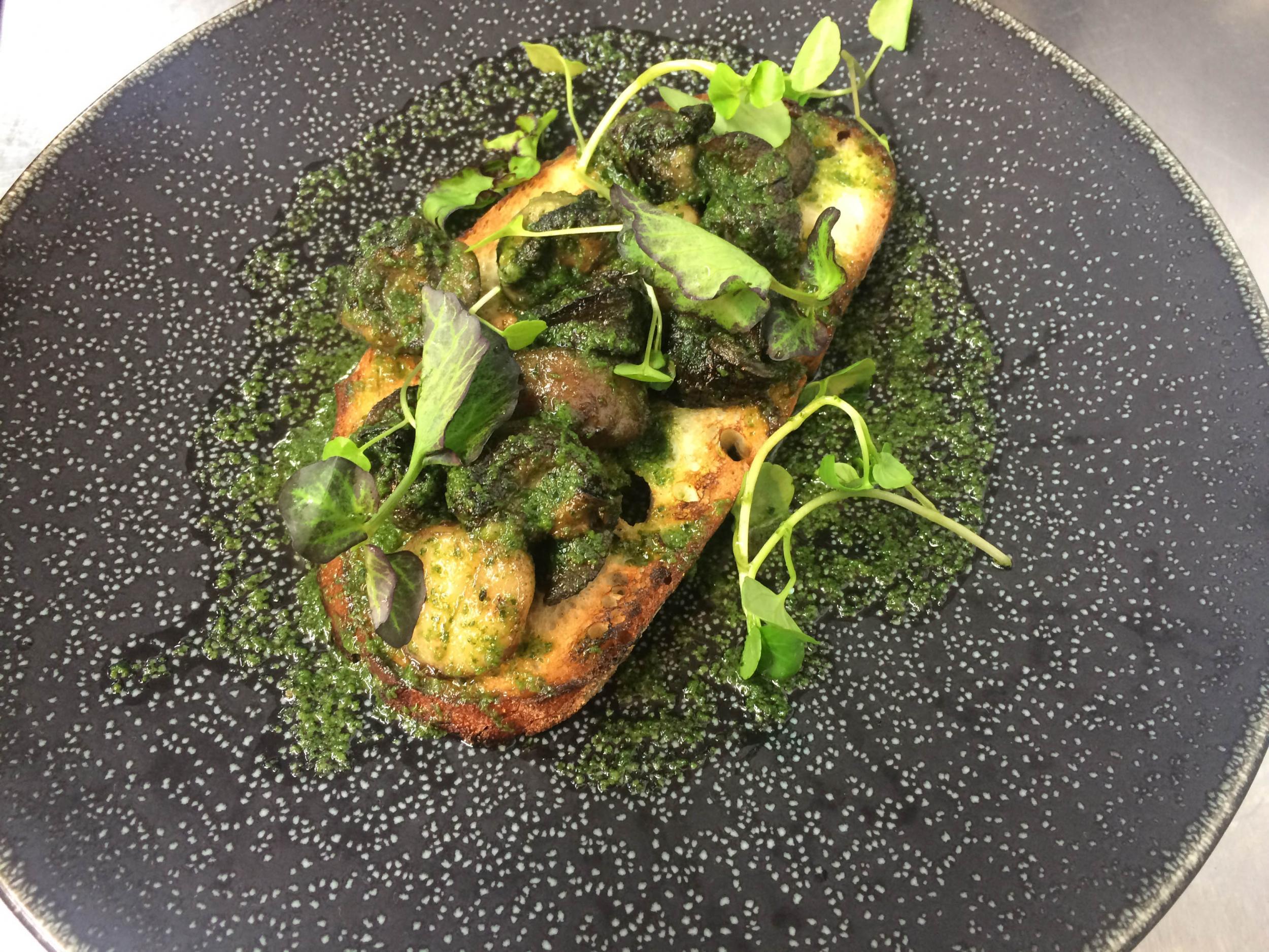 Snail and bone marrow on toast