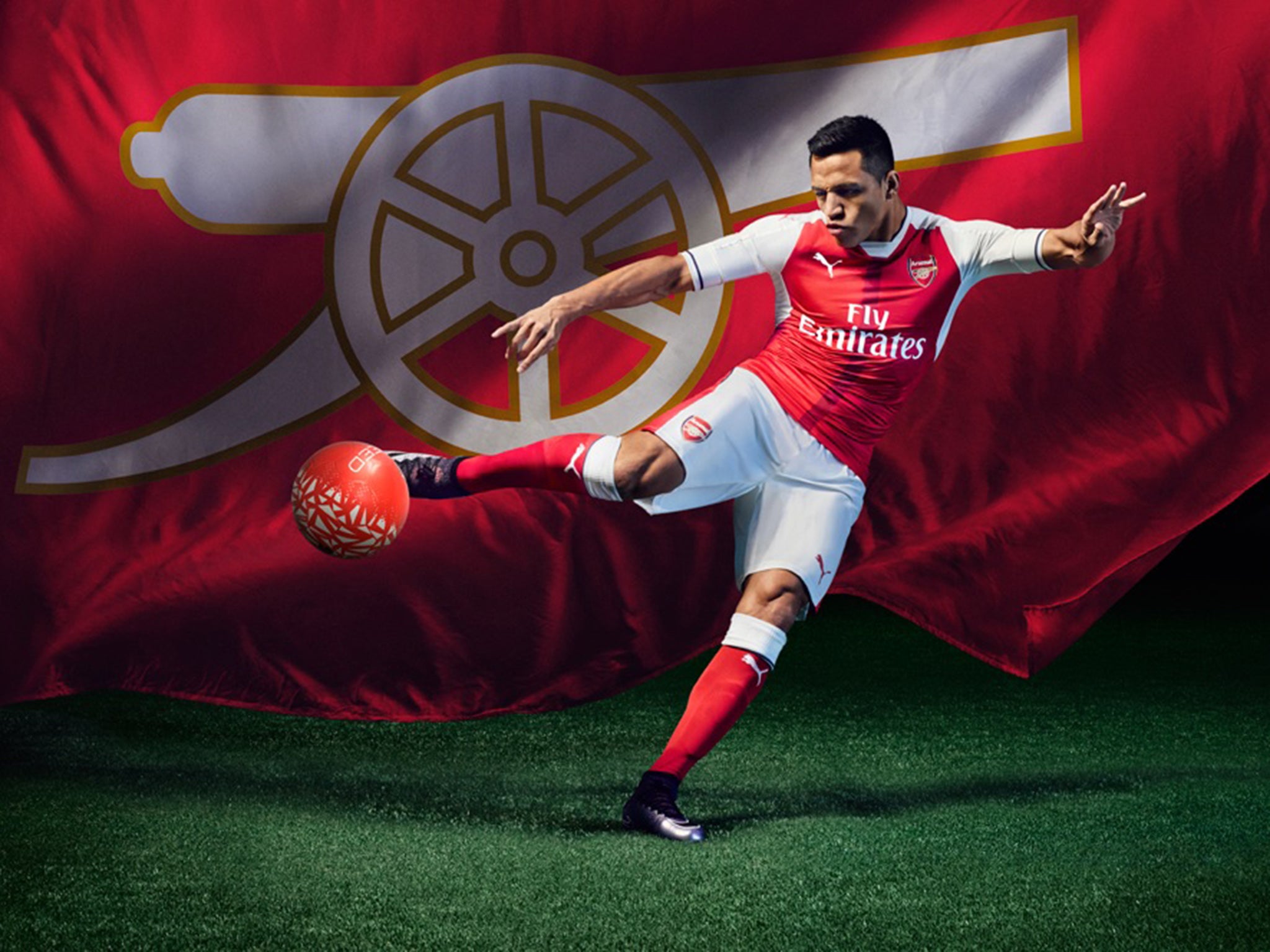 Alexis Sanchez models the new Arsenal shirt