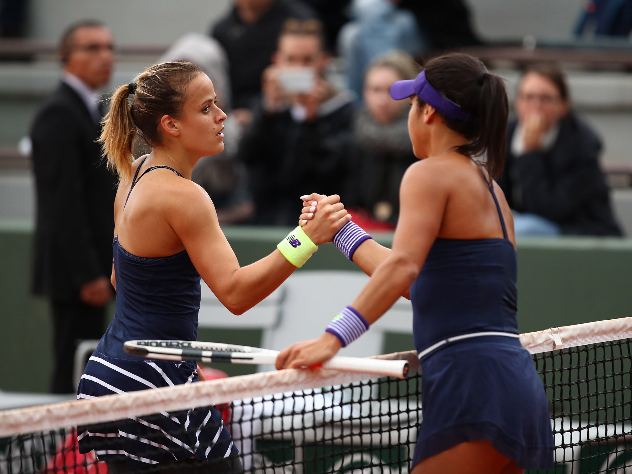 The players shake hands at the end of the first-round match