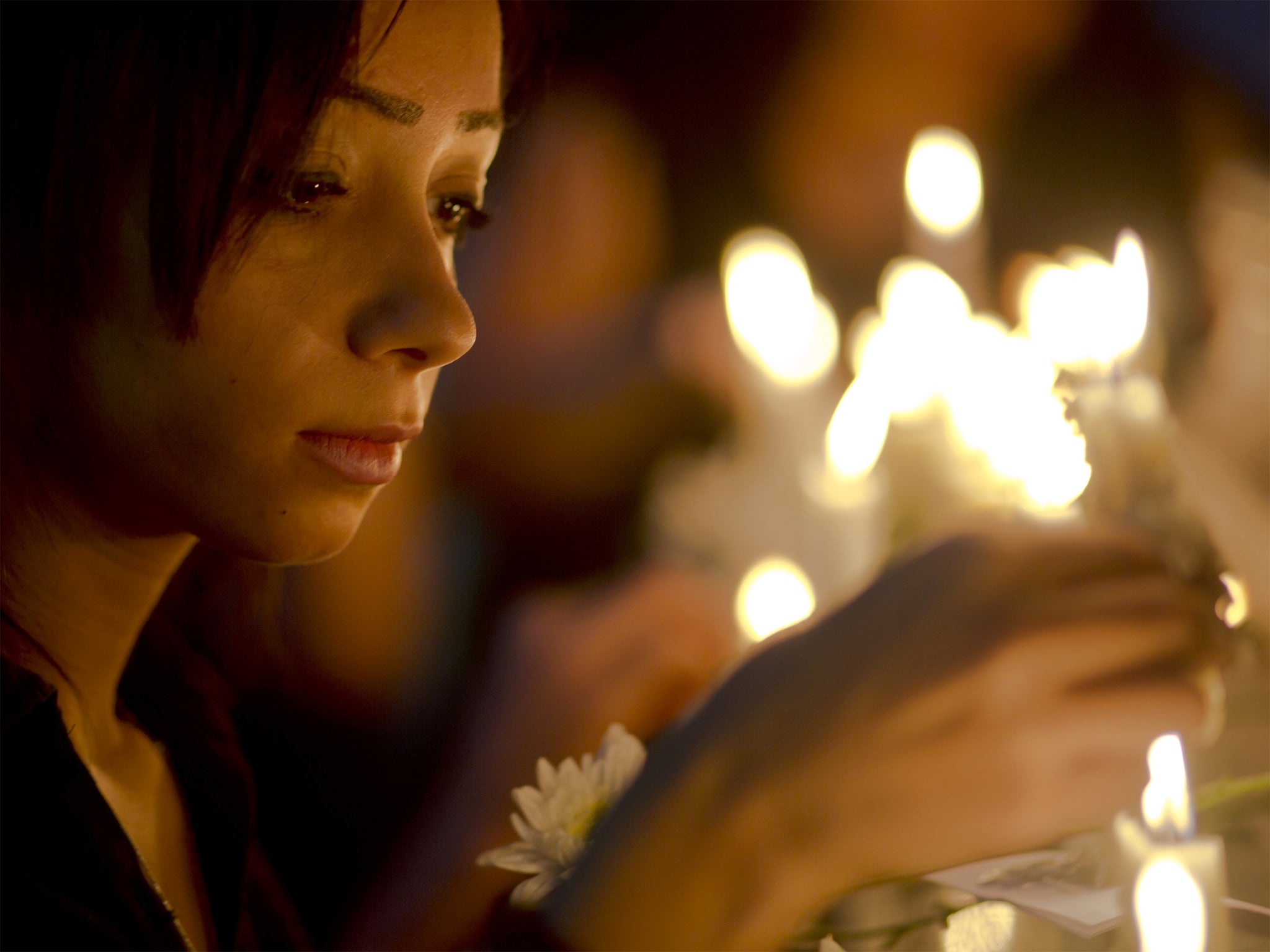 Candles are lit during a vigil for the victims of the crash, in Cairo